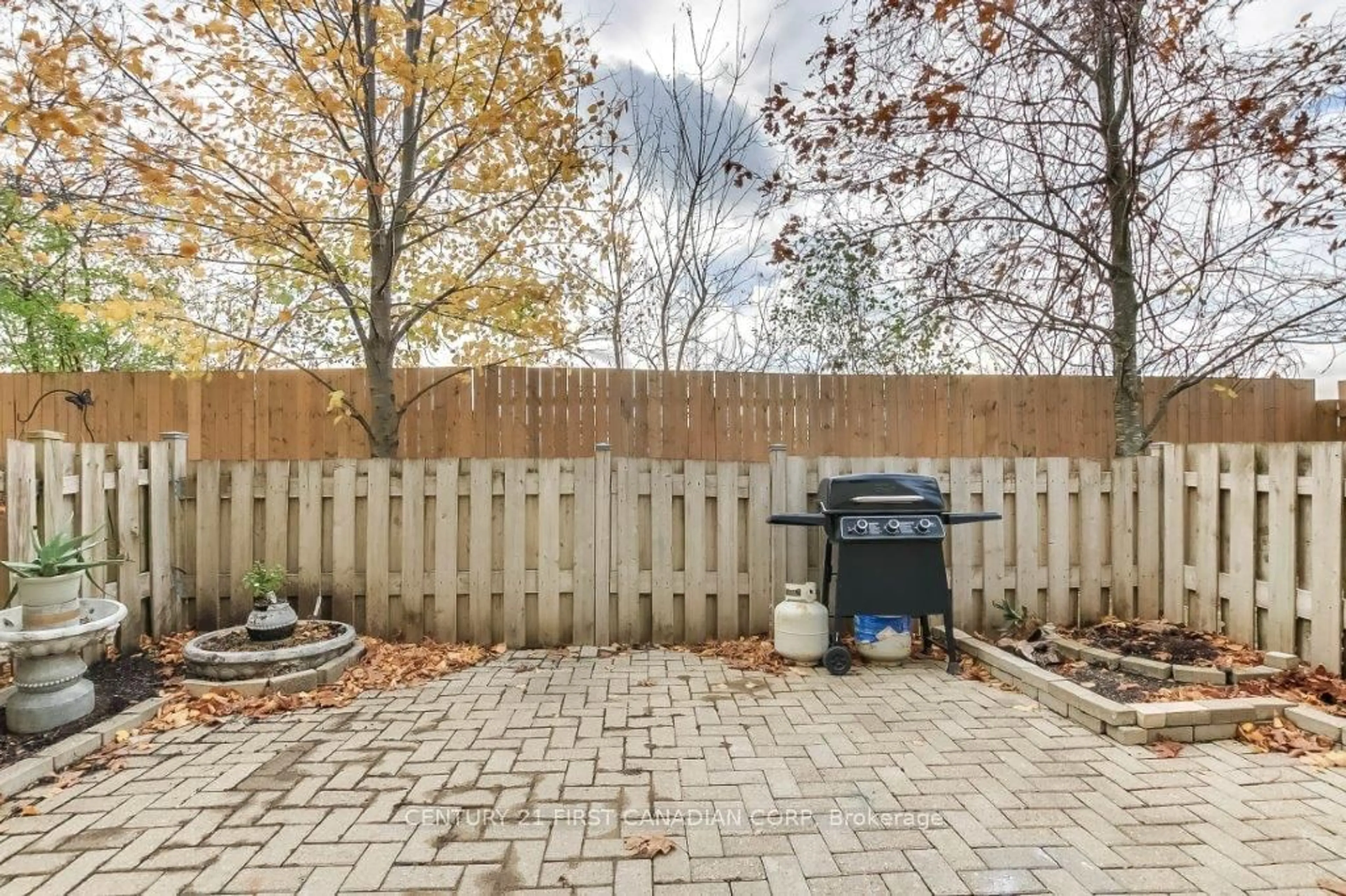 Patio, the fenced backyard for 1990 Wavell St #40, London Ontario N5V 4N5