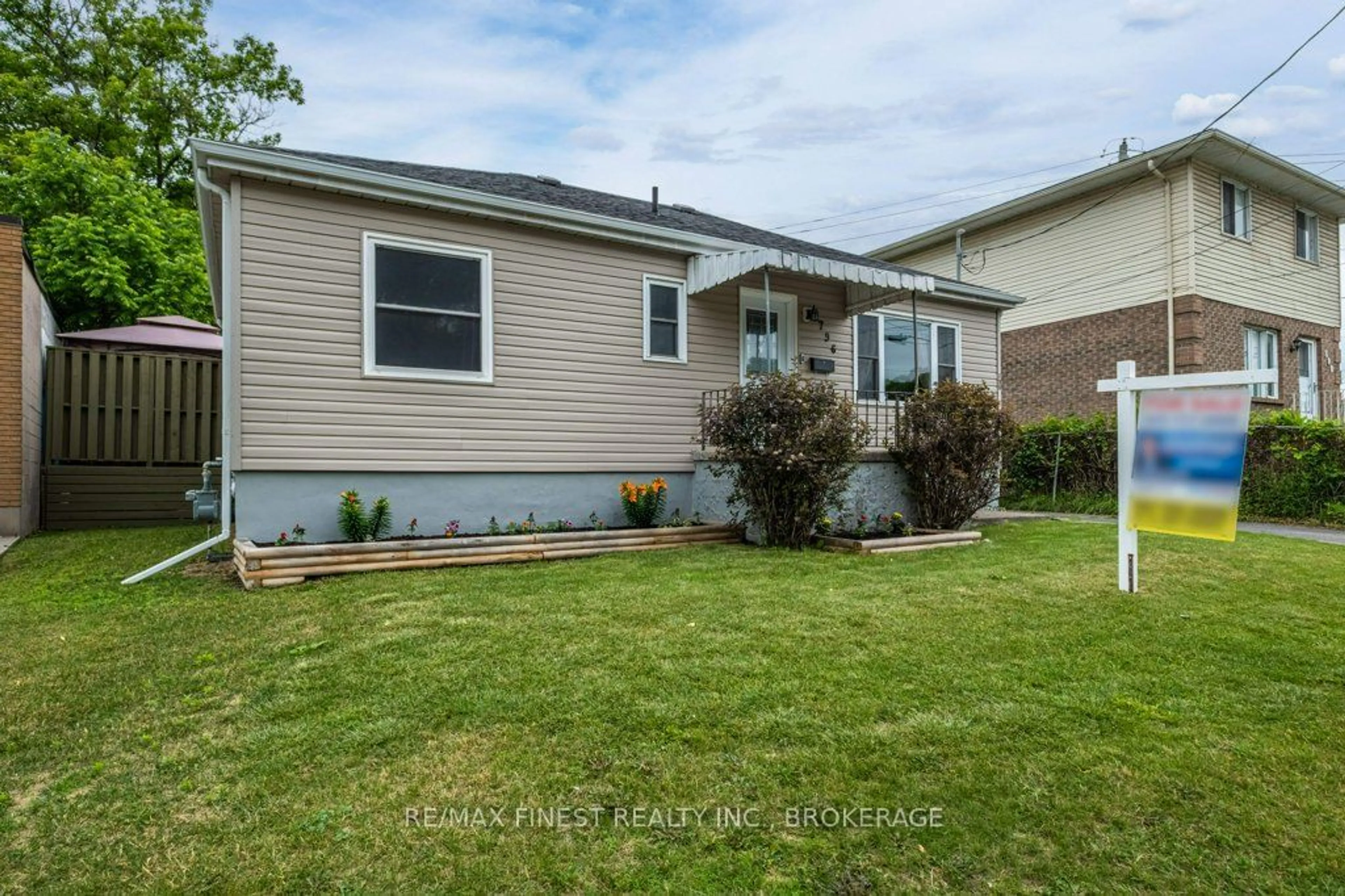 Frontside or backside of a home, the fenced backyard for 796 Montreal St, Kingston Ontario K7K 3J5