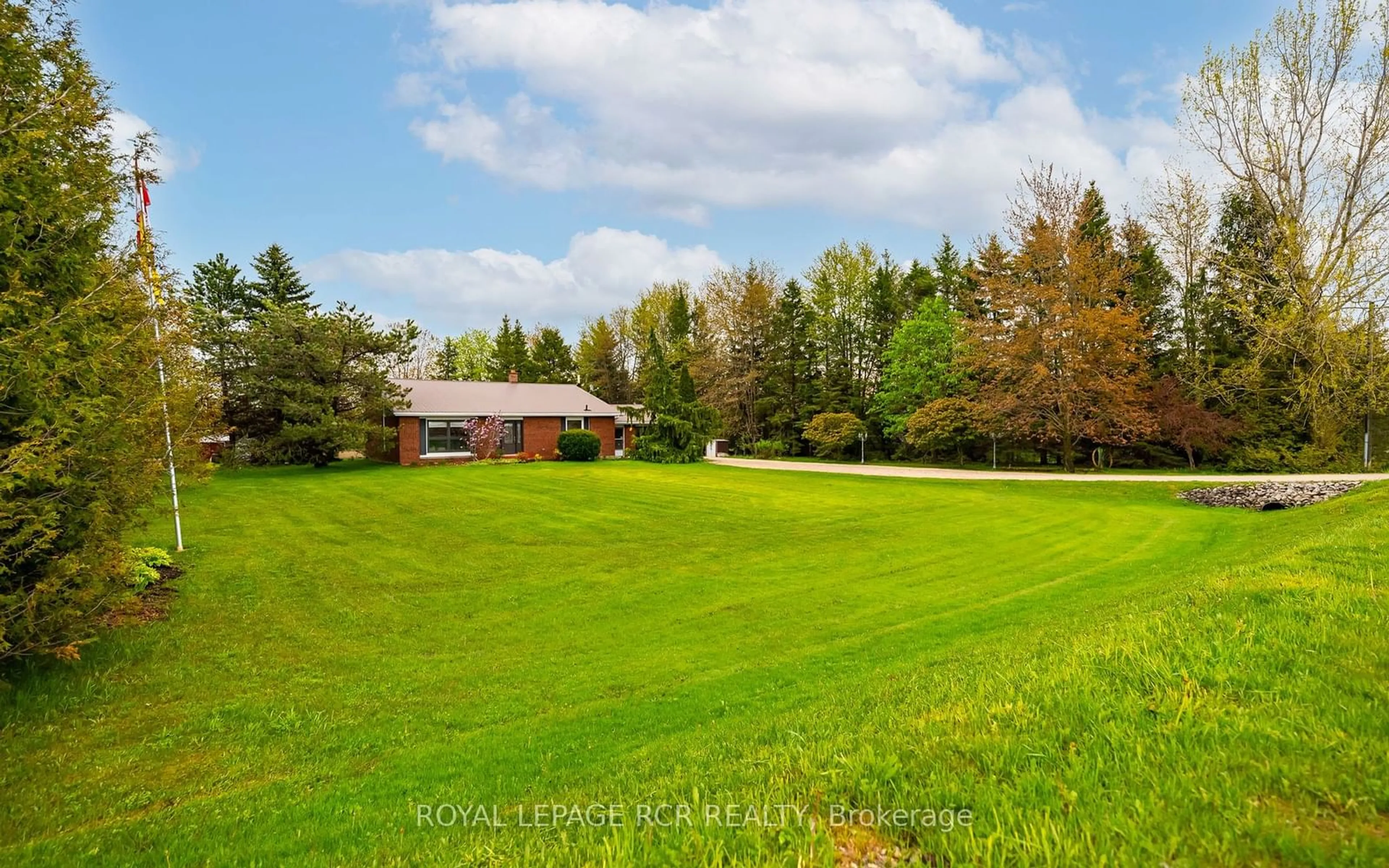 Frontside or backside of a home, the fenced backyard for 433409 4th Line, Amaranth Ontario L9W 0P2