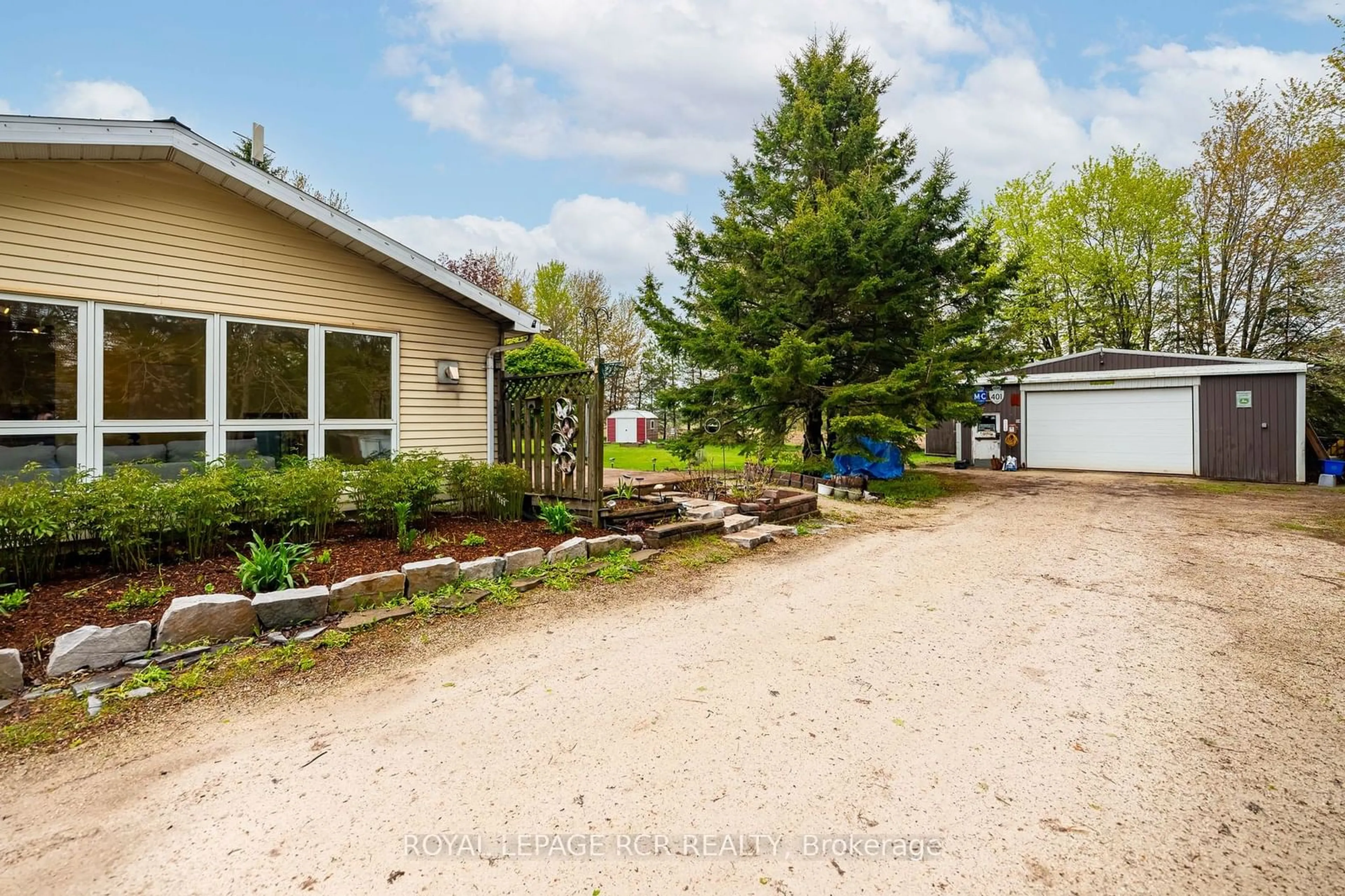 Frontside or backside of a home, the fenced backyard for 433409 4th Line, Amaranth Ontario L9W 0P2