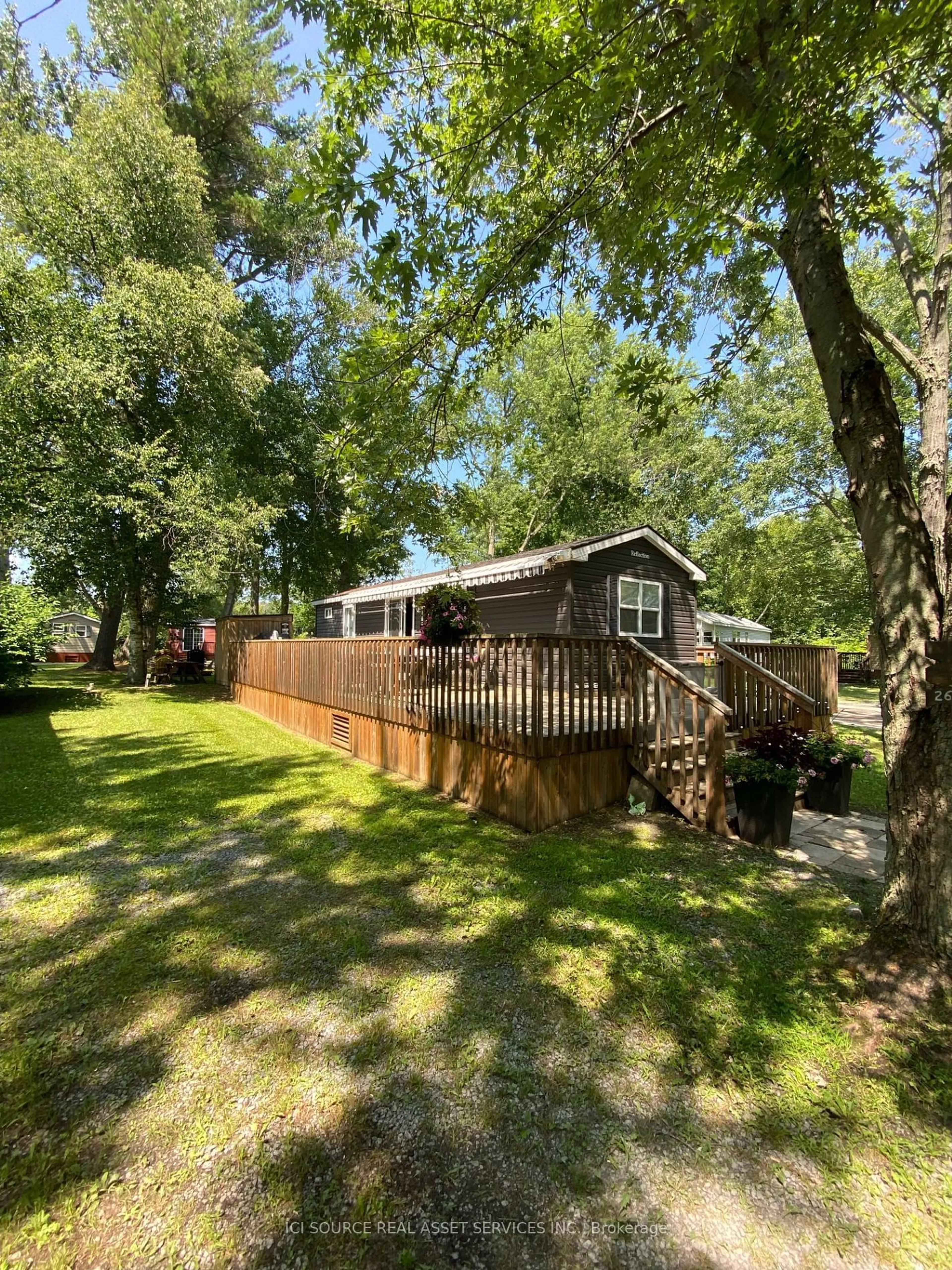 Frontside or backside of a home, the fenced backyard for 486 County Road 18 #FGL026, Mapleton Ontario K0K 1P0