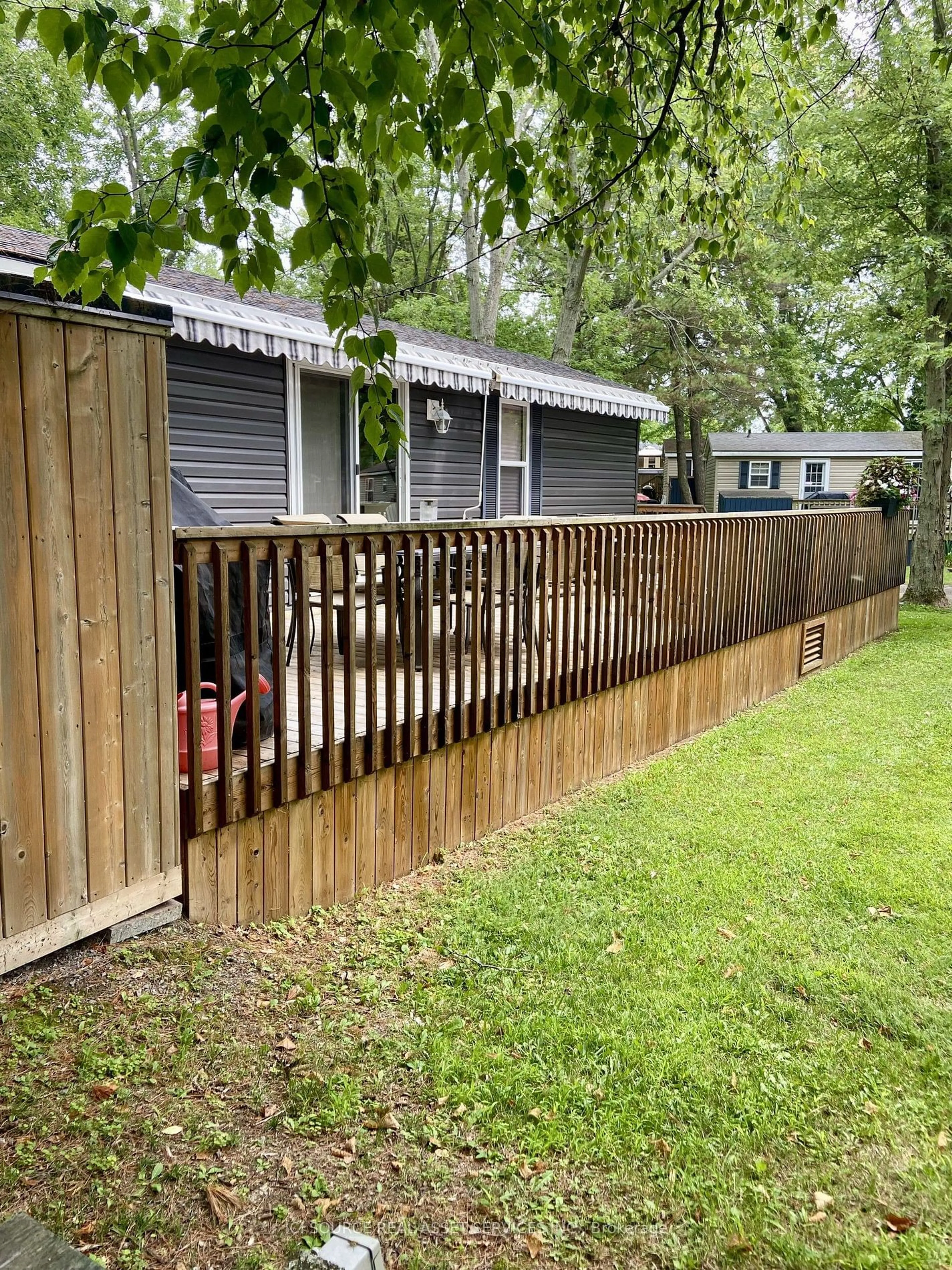 Frontside or backside of a home, the fenced backyard for 486 County Road 18 #FGL026, Mapleton Ontario K0K 1P0