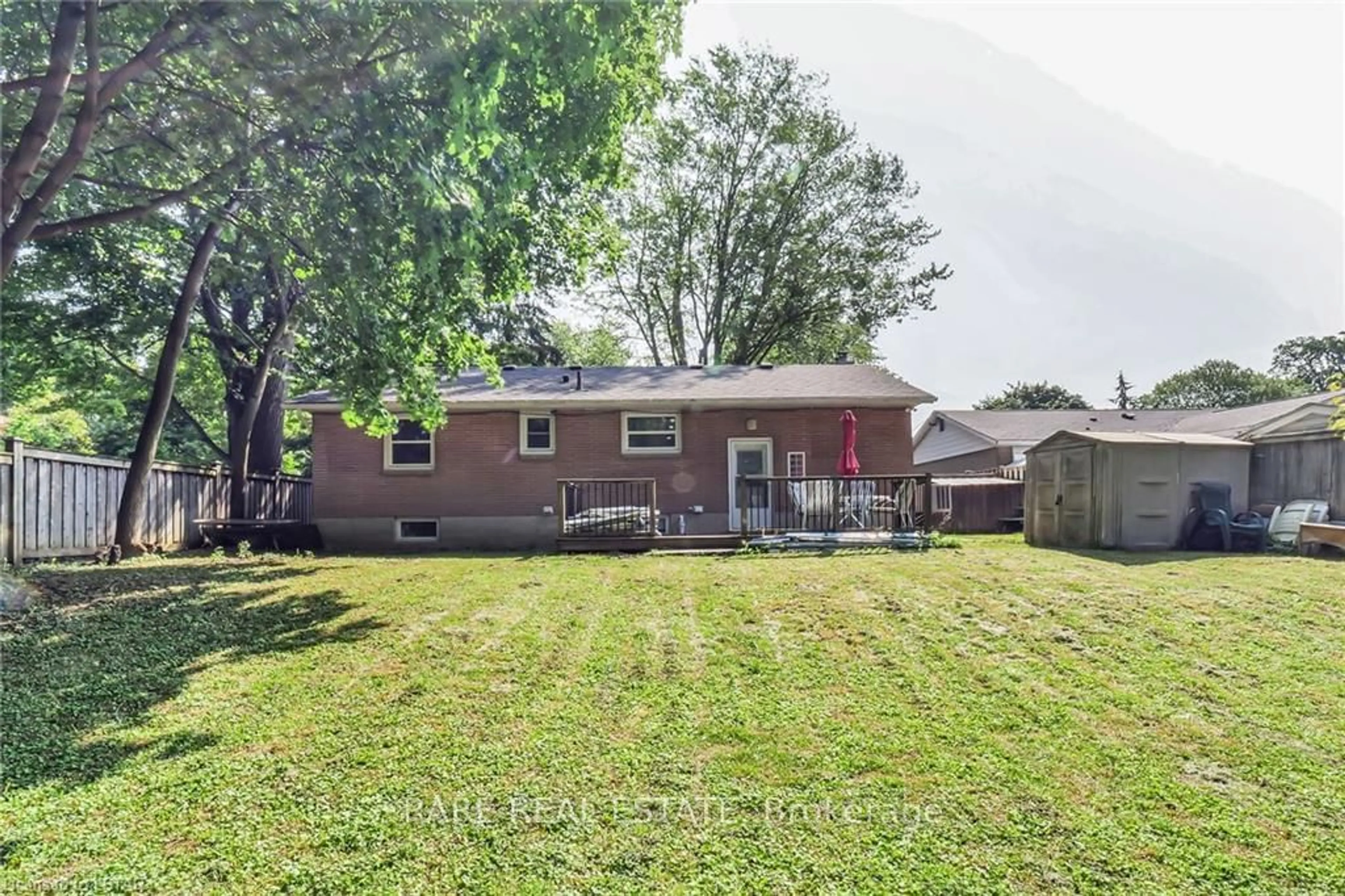 Frontside or backside of a home, the fenced backyard for 31 Thorncrest Cres, London Ontario N6J 1K4