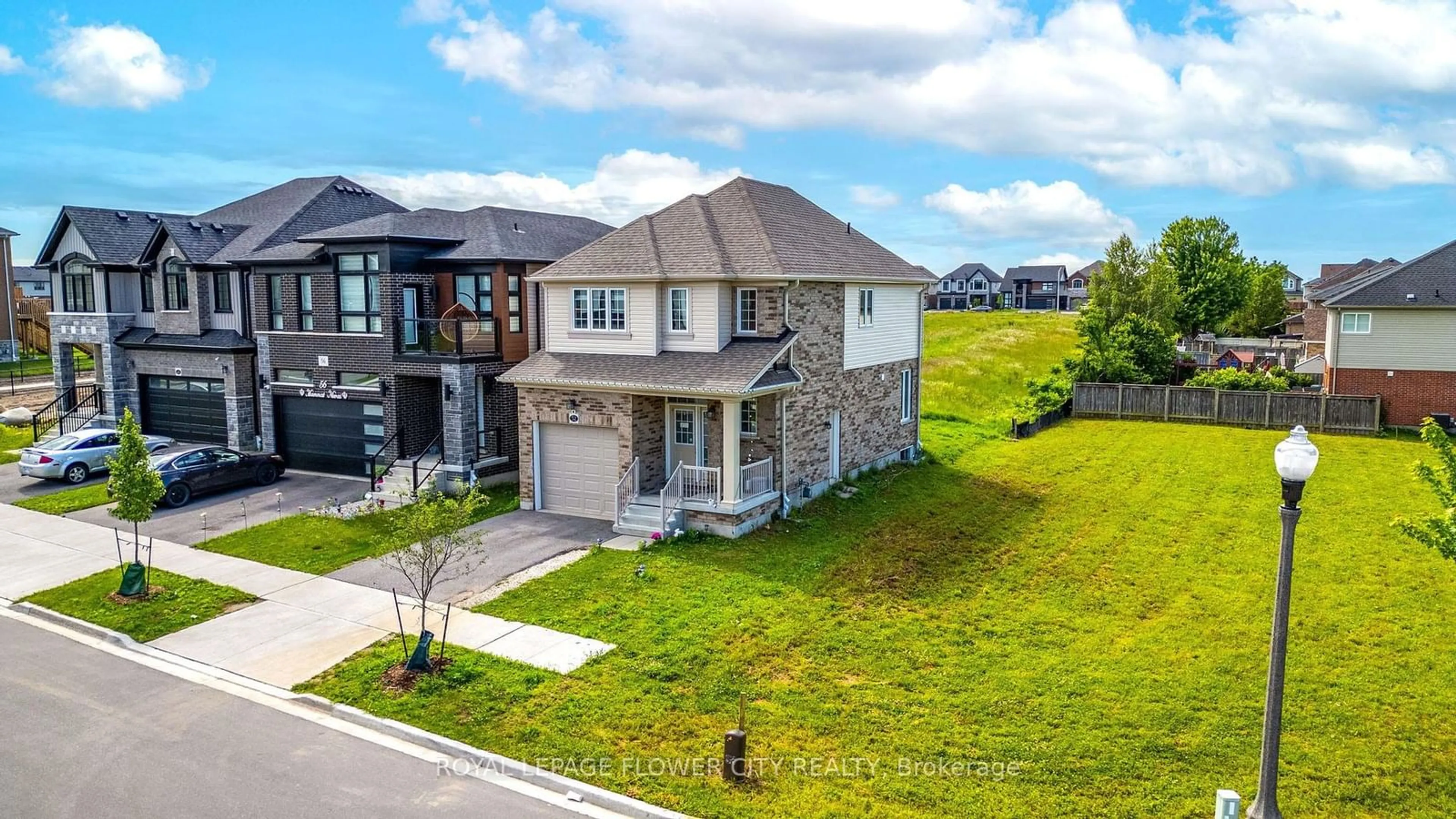 Frontside or backside of a home, the street view for 52 Monarch Woods Dr, Kitchener Ontario N2P 2Y9