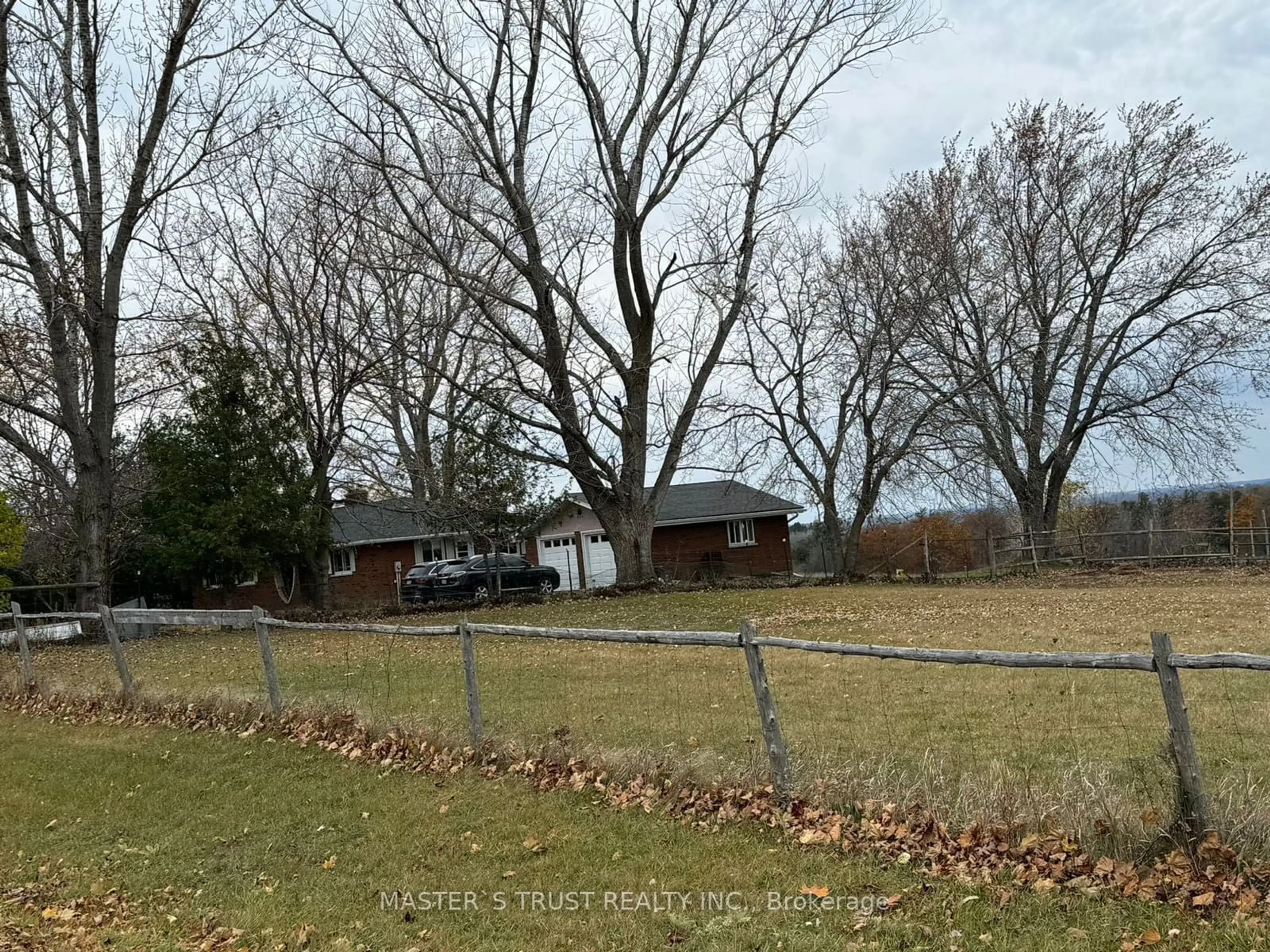 Frontside or backside of a home, the fenced backyard for 9722 Corkery Rd, Hamilton Township Ontario K0K 2H0