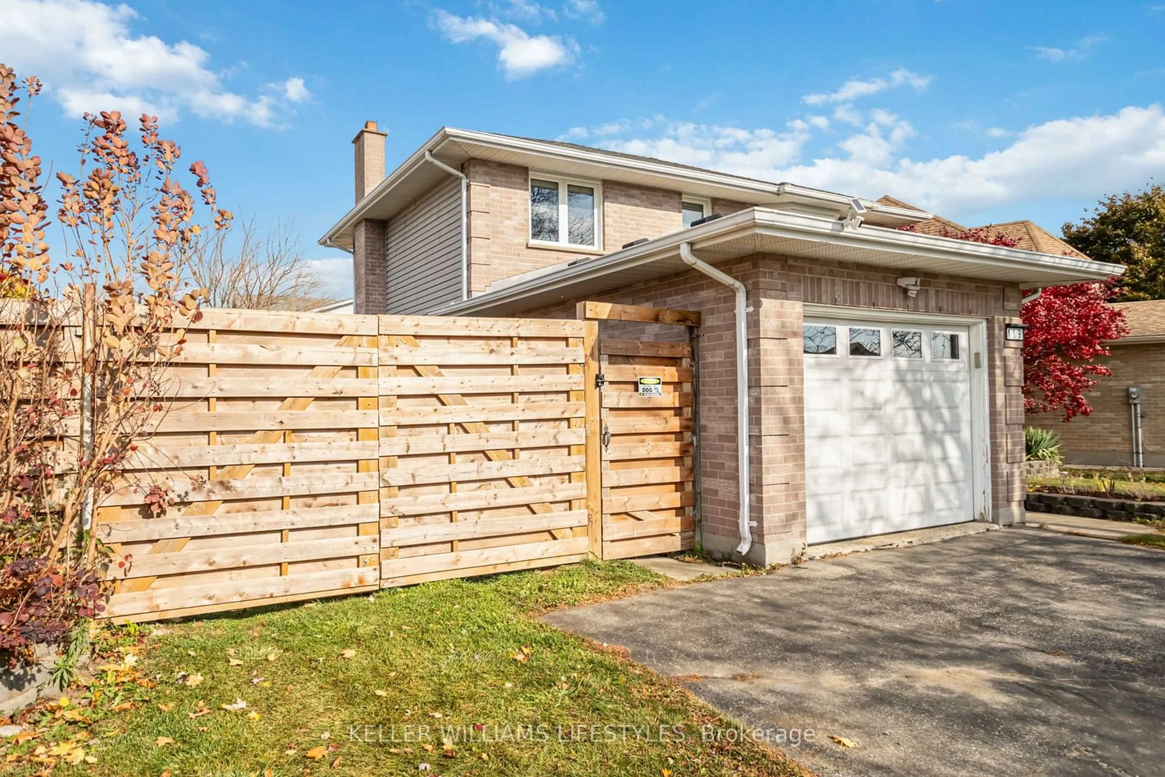 Frontside or backside of a home, the fenced backyard for 119 Napoleon Crt, London Ontario N5V 4B4