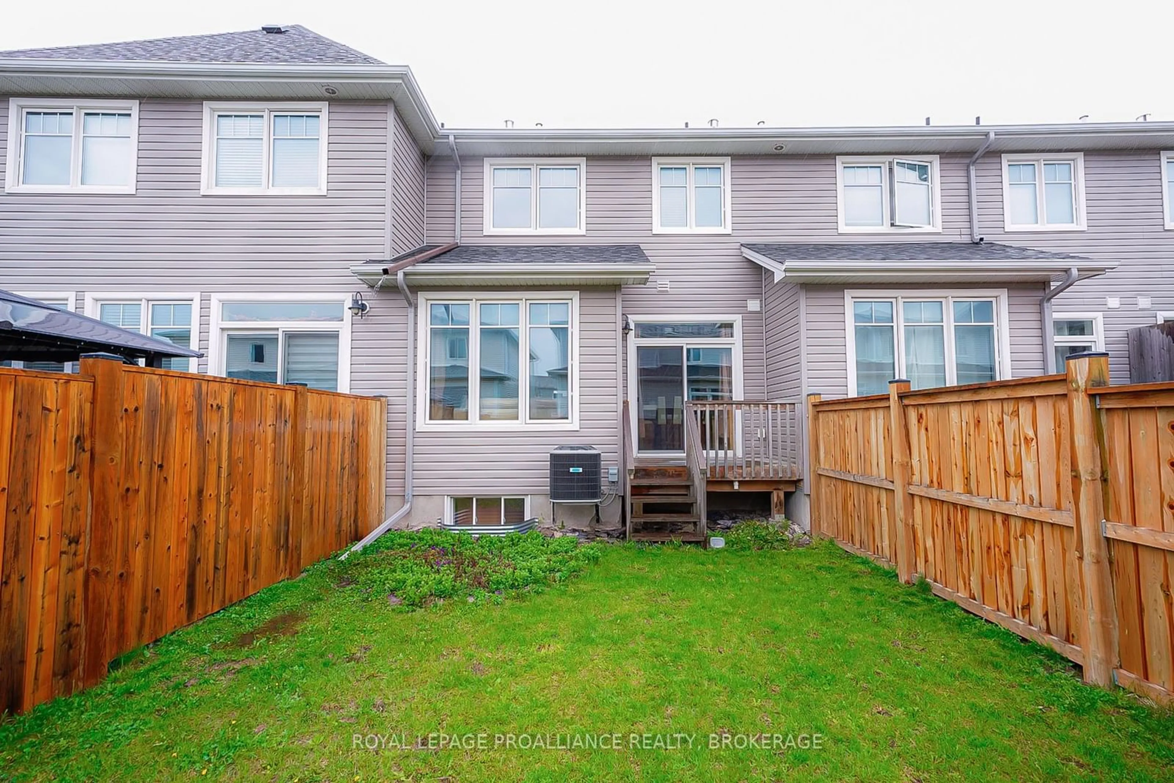 Frontside or backside of a home, the fenced backyard for 1341 TREMONT Dr, Kingston Ontario K7P 0M5