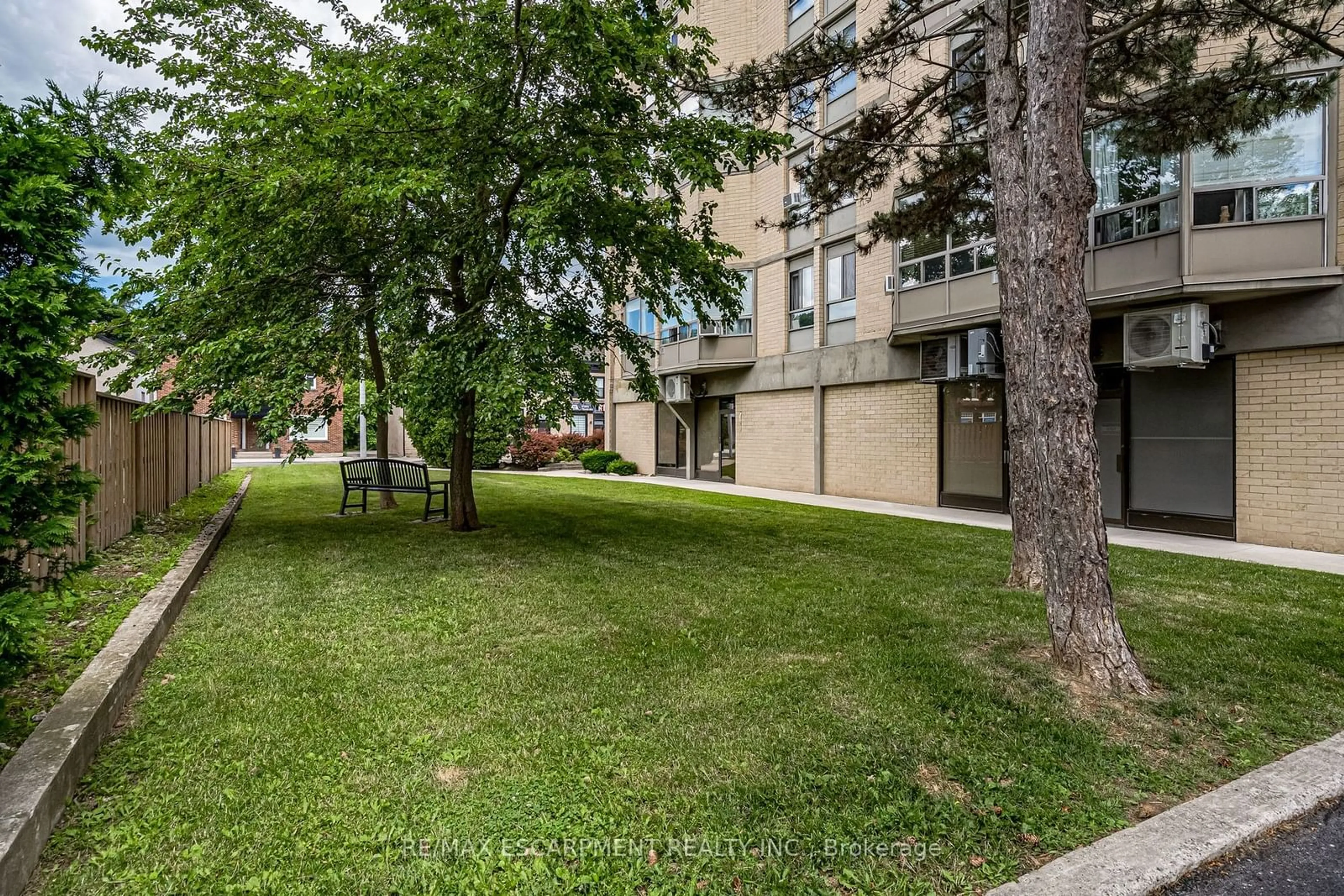 A pic from exterior of the house or condo, the street view for 10 John St #209, Hamilton Ontario L9H 6J3