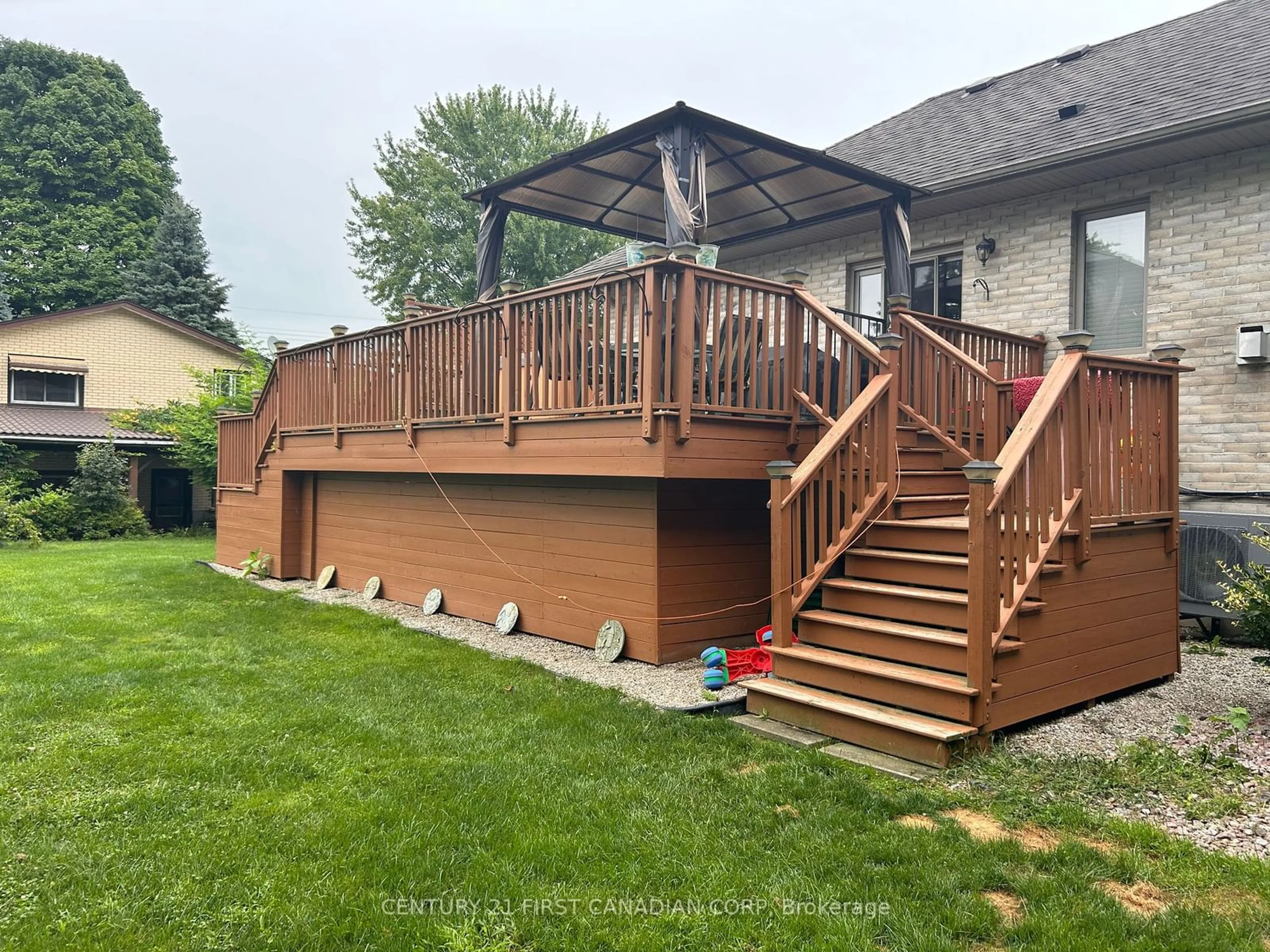 Frontside or backside of a home, the fenced backyard for 109 Princess Ave, Middlesex Centre Ontario N0L 1R0