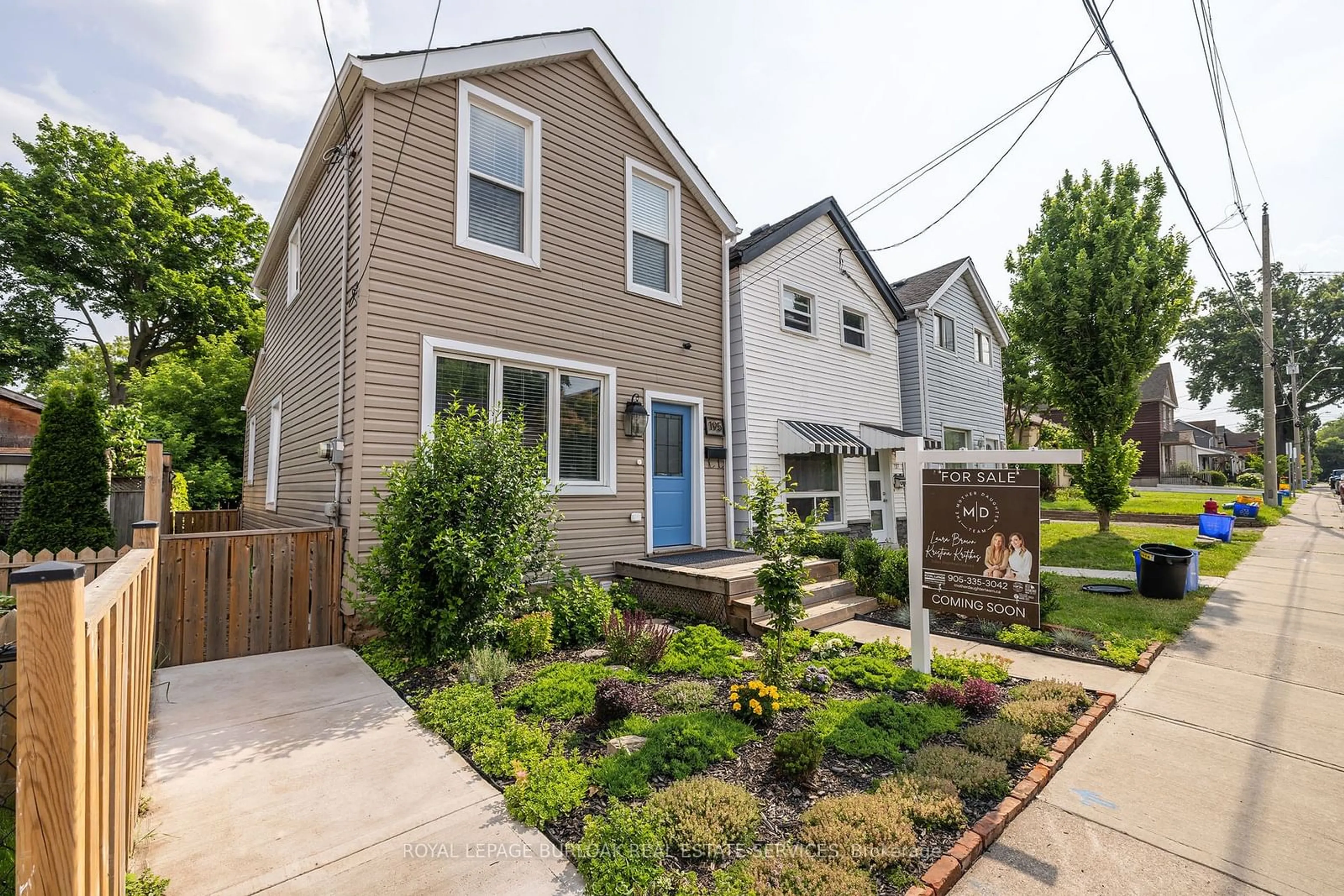 Frontside or backside of a home, the fenced backyard for 195 Wood St, Hamilton Ontario L8L 3Z2