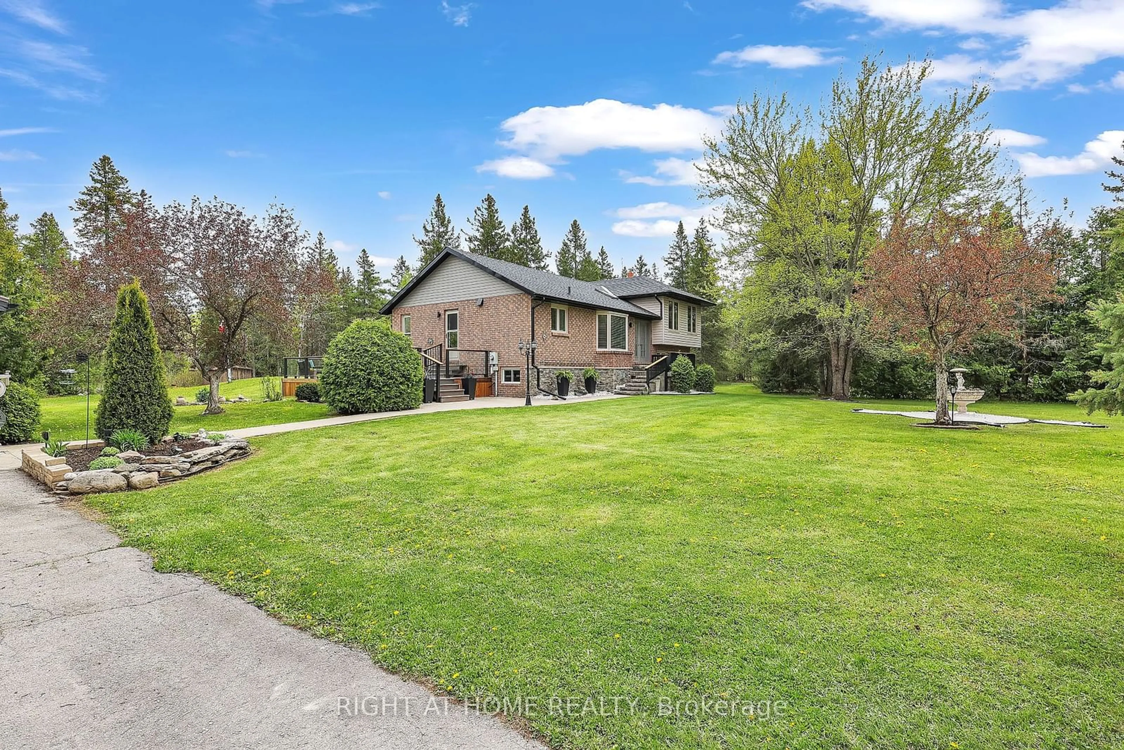 Frontside or backside of a home, the fenced backyard for 119 Sturgeon Glen Rd, Kawartha Lakes Ontario K0M 1N0