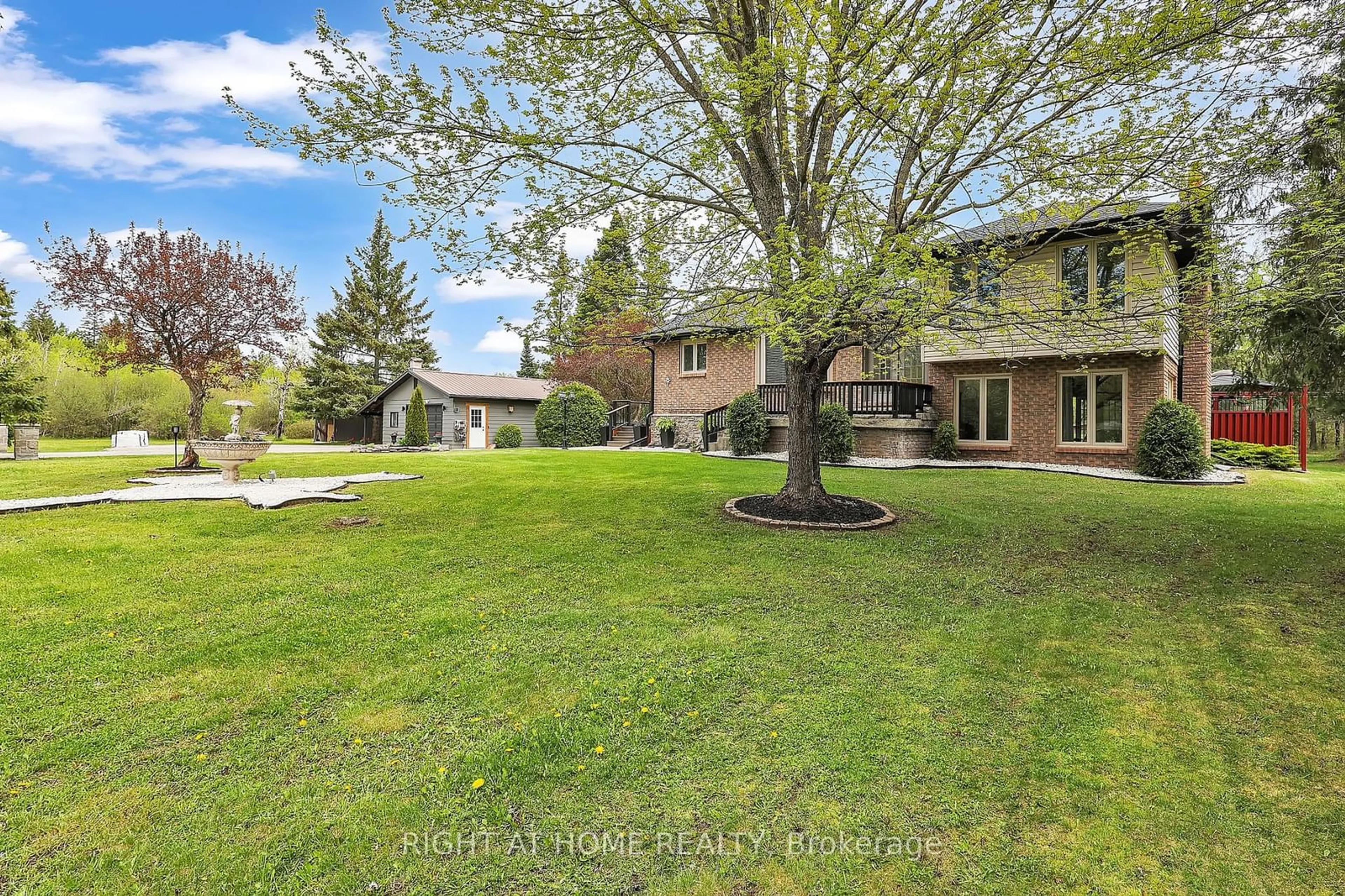 A pic from exterior of the house or condo, the fenced backyard for 119 Sturgeon Glen Rd, Kawartha Lakes Ontario K0M 1N0