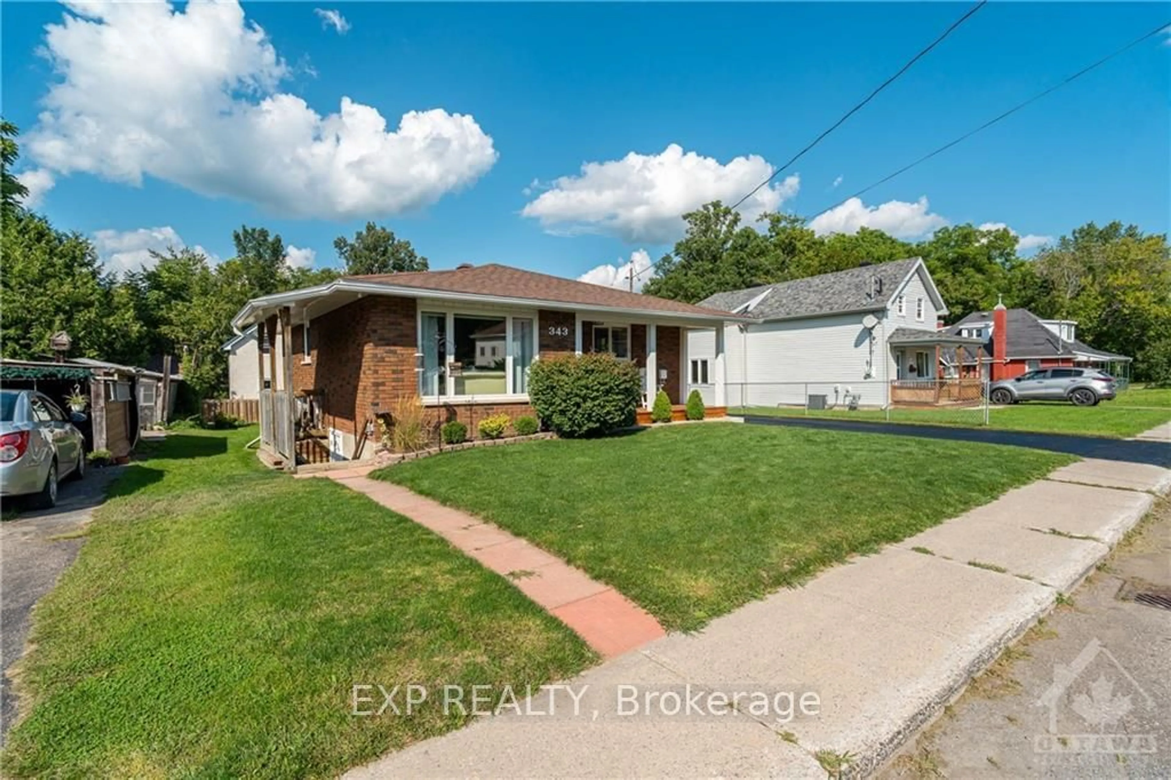 Frontside or backside of a home, the fenced backyard for 343 HARRY St, Renfrew Ontario K7V 3E3