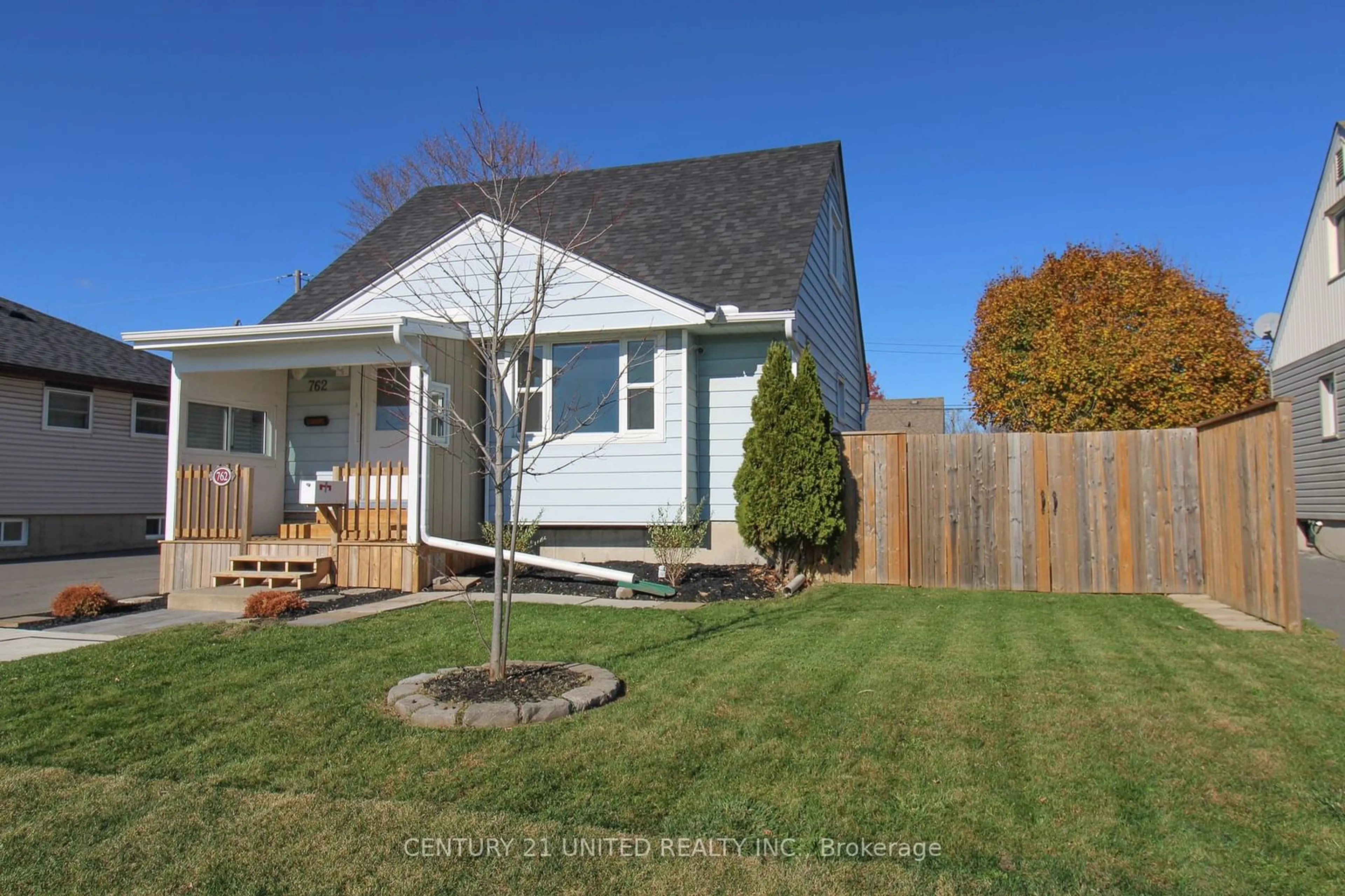 Frontside or backside of a home, the fenced backyard for 762 Gillespie Ave, Peterborough Ontario K9J 4B7