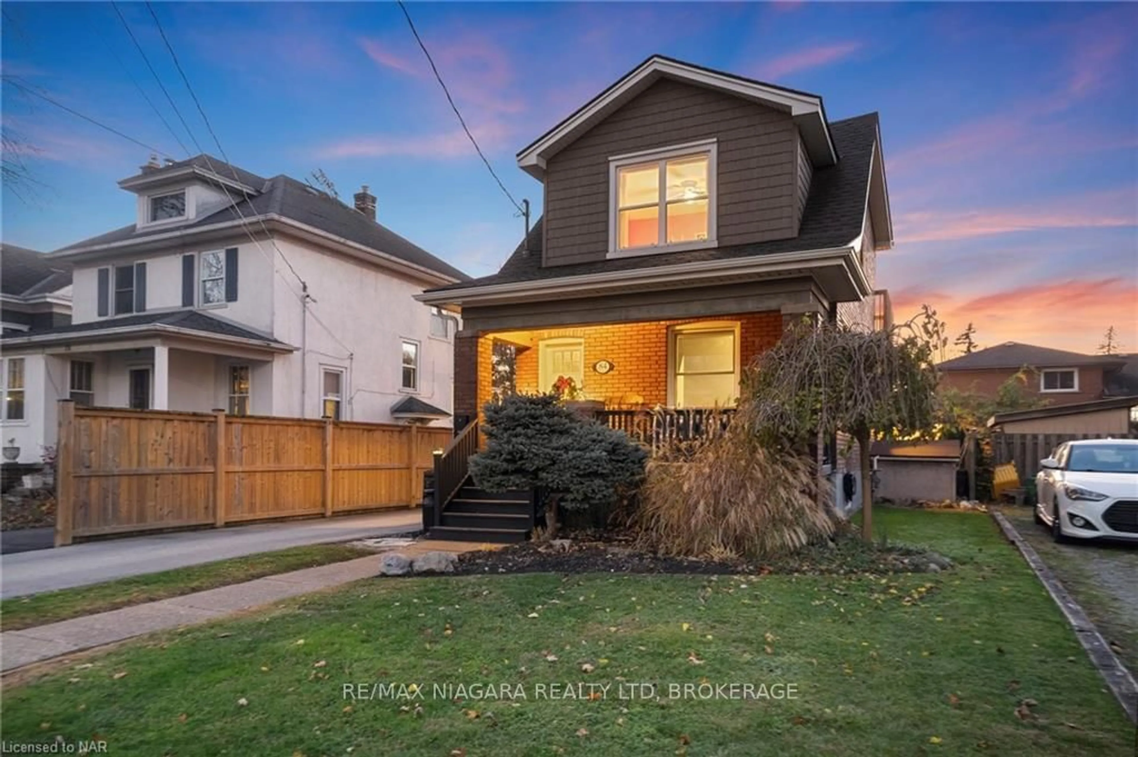 Frontside or backside of a home, the fenced backyard for 84 STEELE St, Port Colborne Ontario L3K 4X2