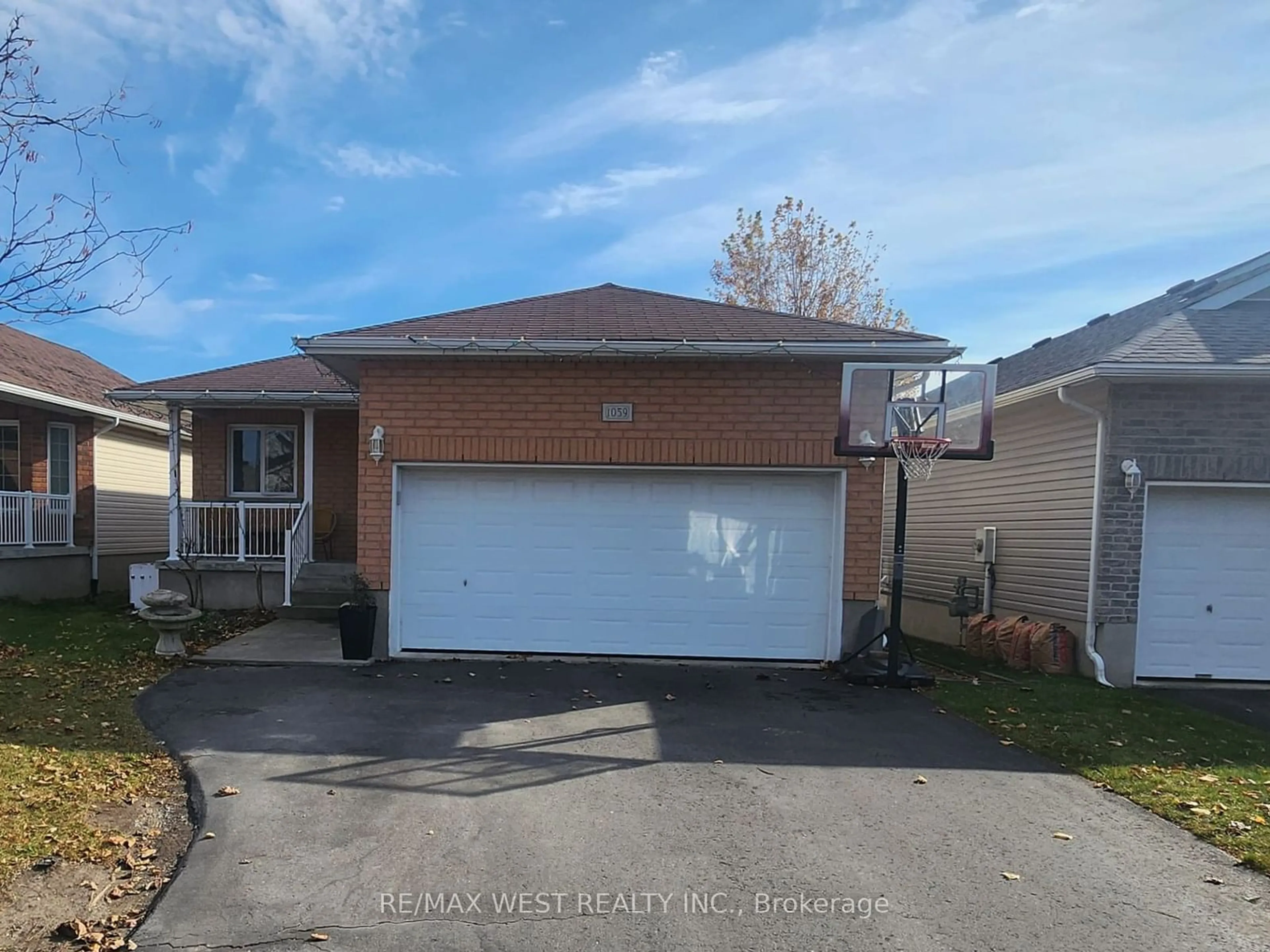 Frontside or backside of a home, the street view for 1059 Greenwood Park, Kingston Ontario K7K 0A4