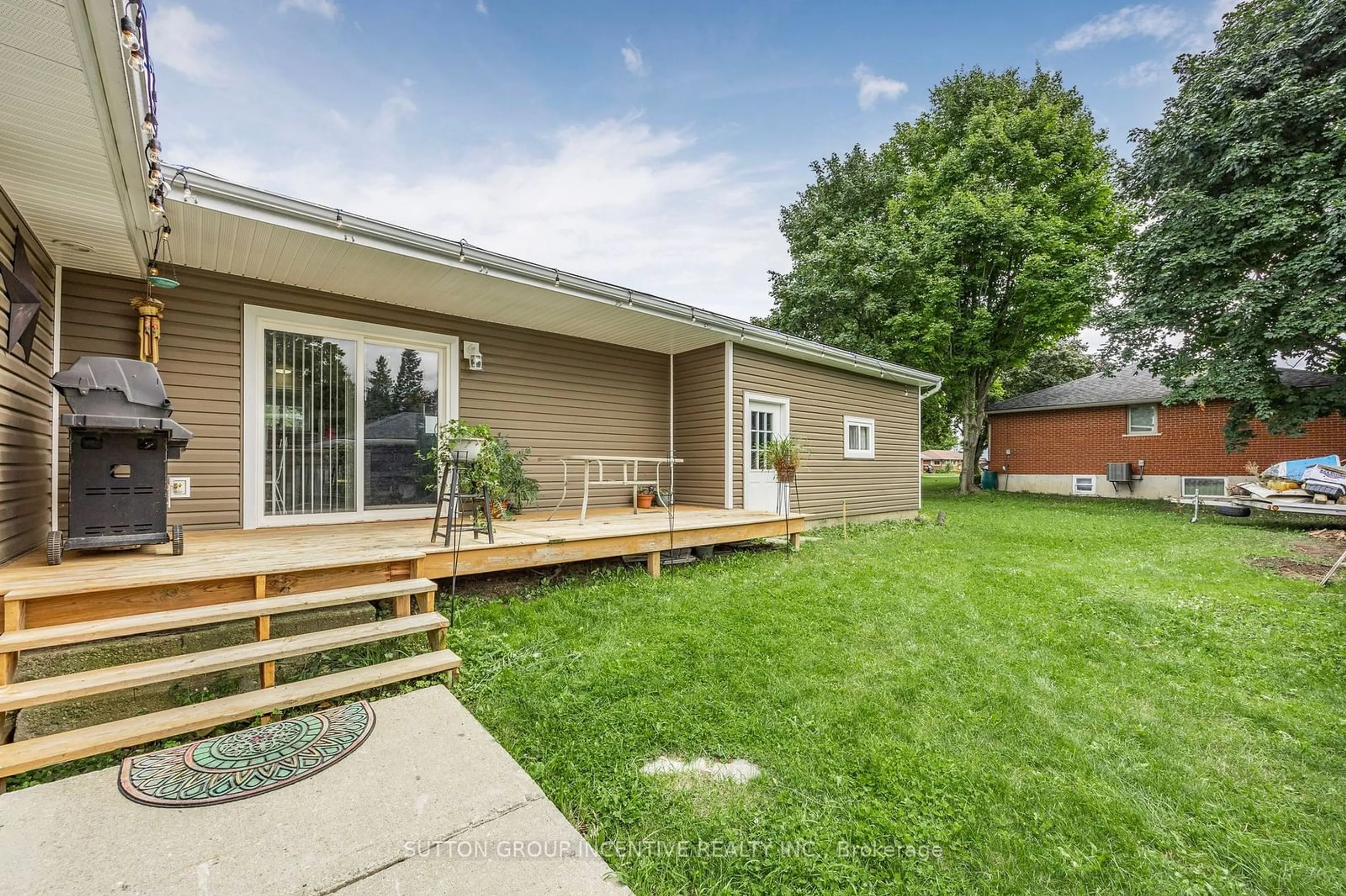 Frontside or backside of a home, the fenced backyard for 173 Main St, Grey Highlands Ontario N0C 1H0