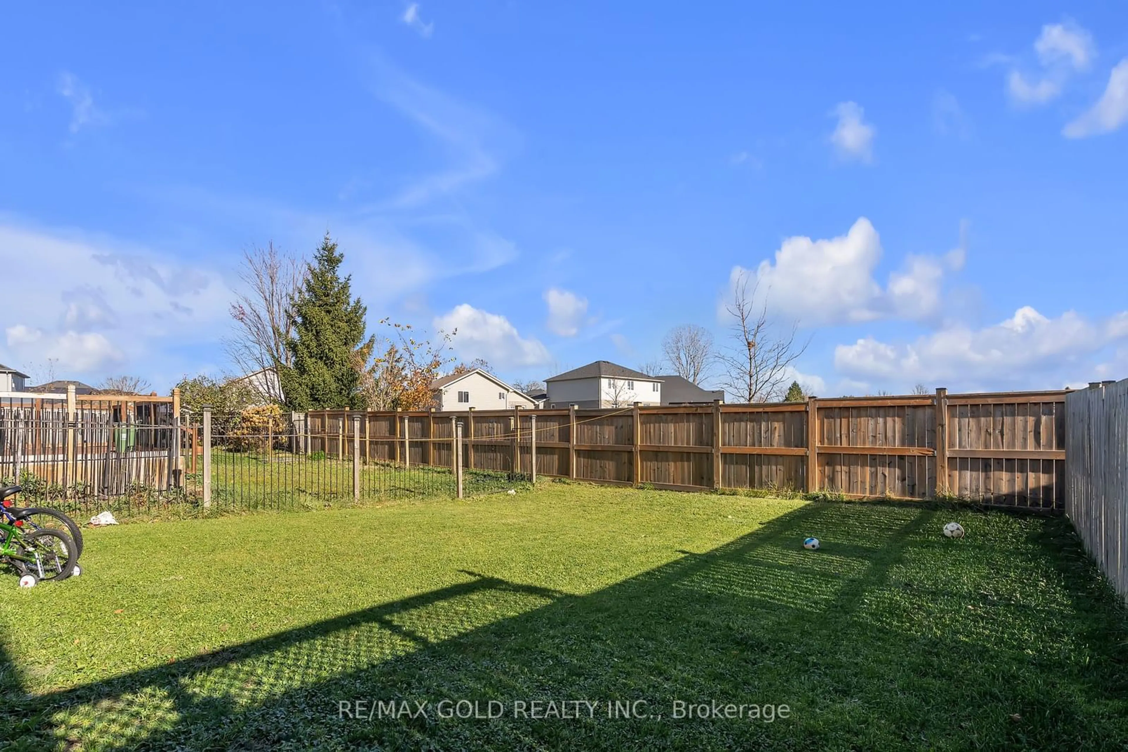 Frontside or backside of a home, the fenced backyard for 2521 MEADOWGATE Blvd, London Ontario N6M 1L8