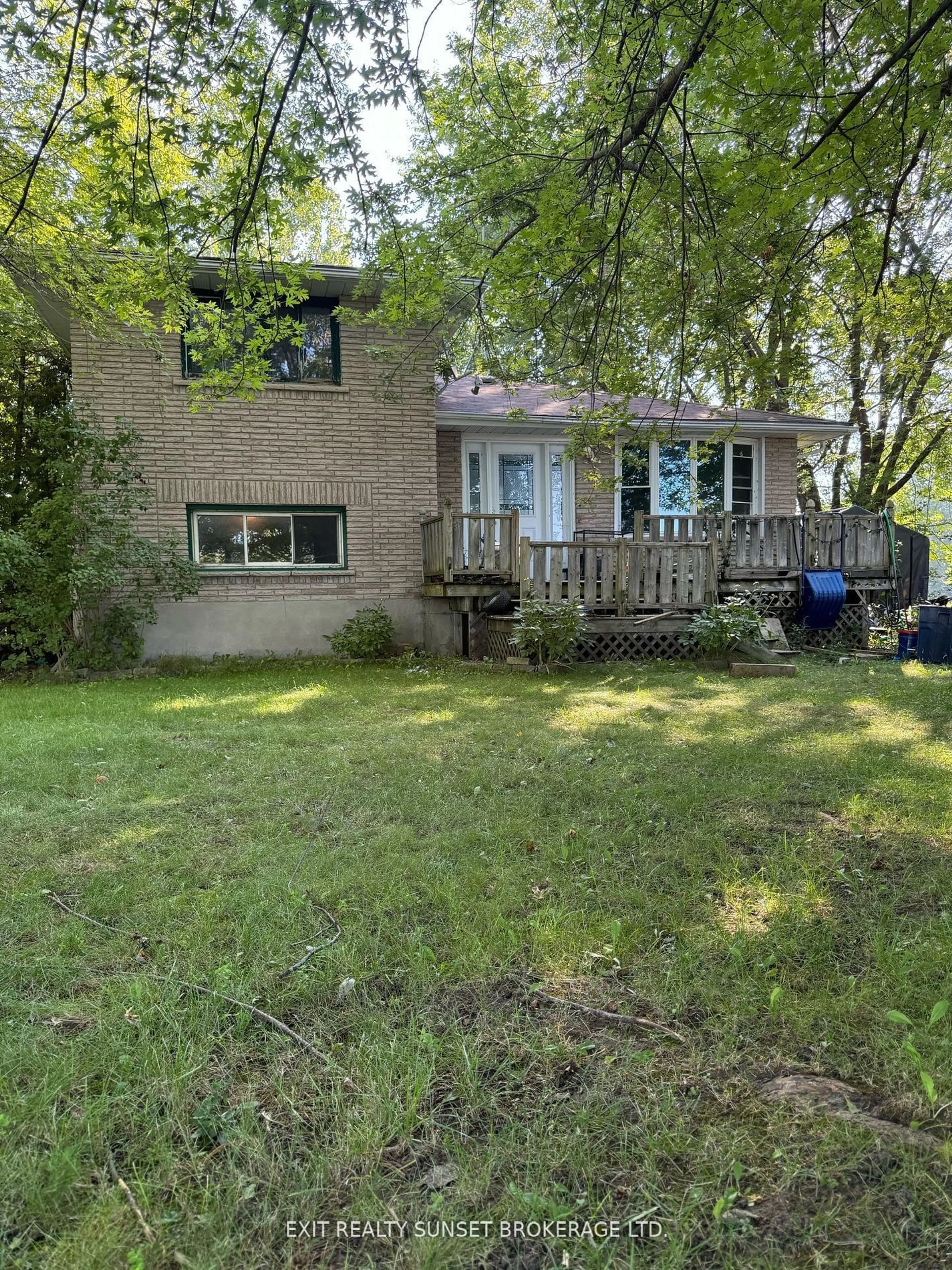 Frontside or backside of a home, the fenced backyard for 113 Anderson Dr, Kawartha Lakes Ontario K0M 1G0