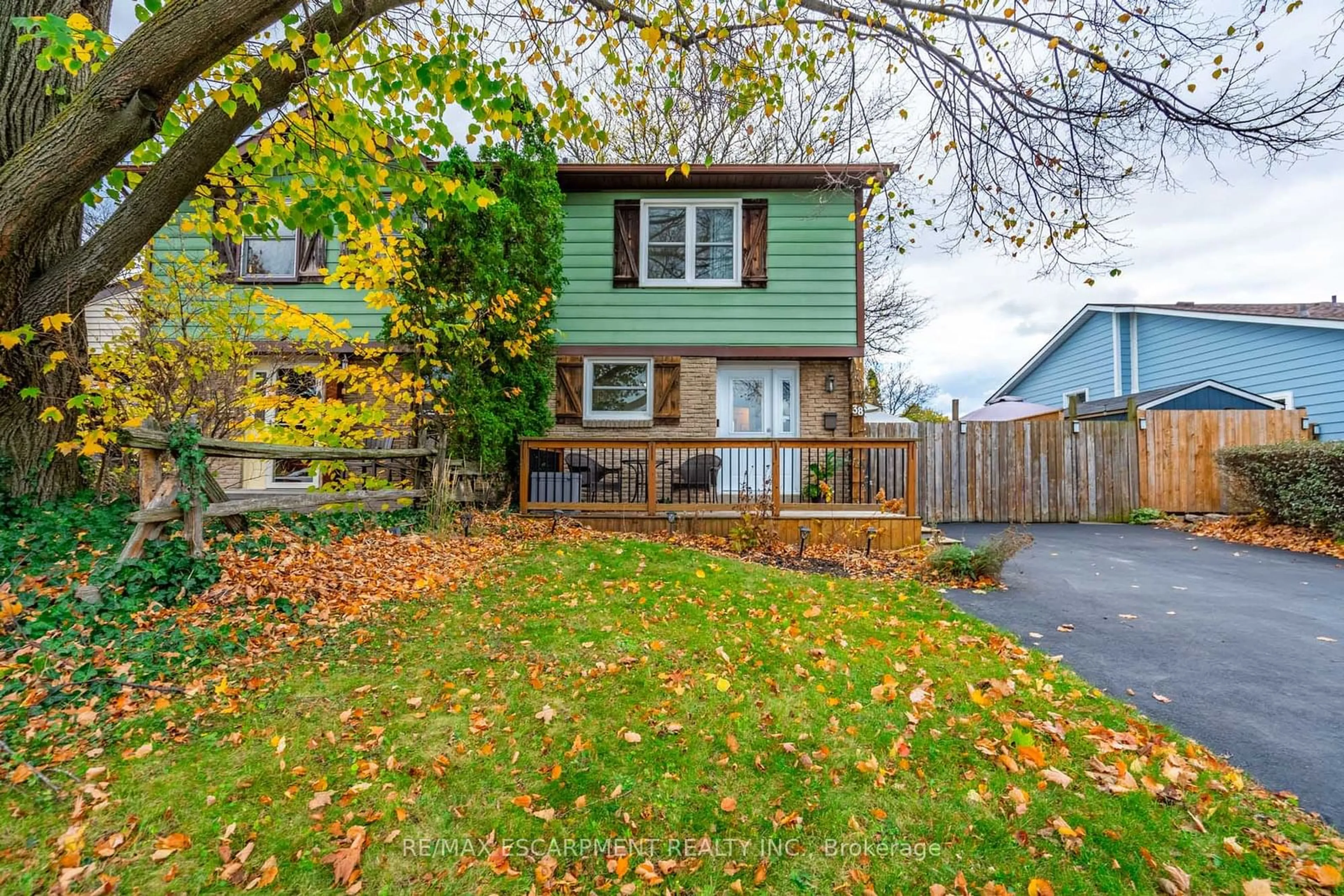 Frontside or backside of a home, the fenced backyard for 38 Golden Orchard Dr, Hamilton Ontario L9C 6J5