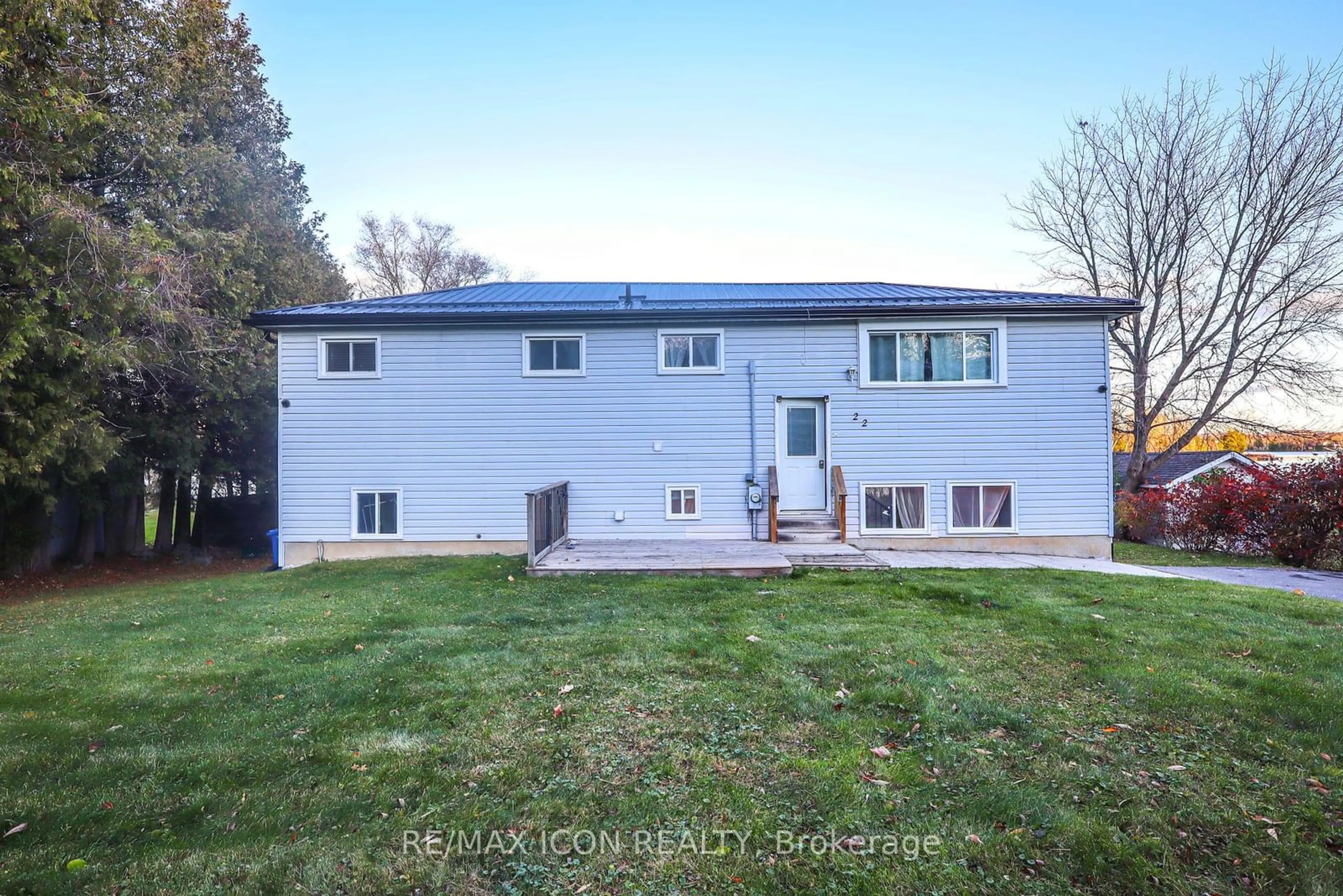 Frontside or backside of a home, the fenced backyard for 22 Lawrence St, Kawartha Lakes Ontario K9J 6X3