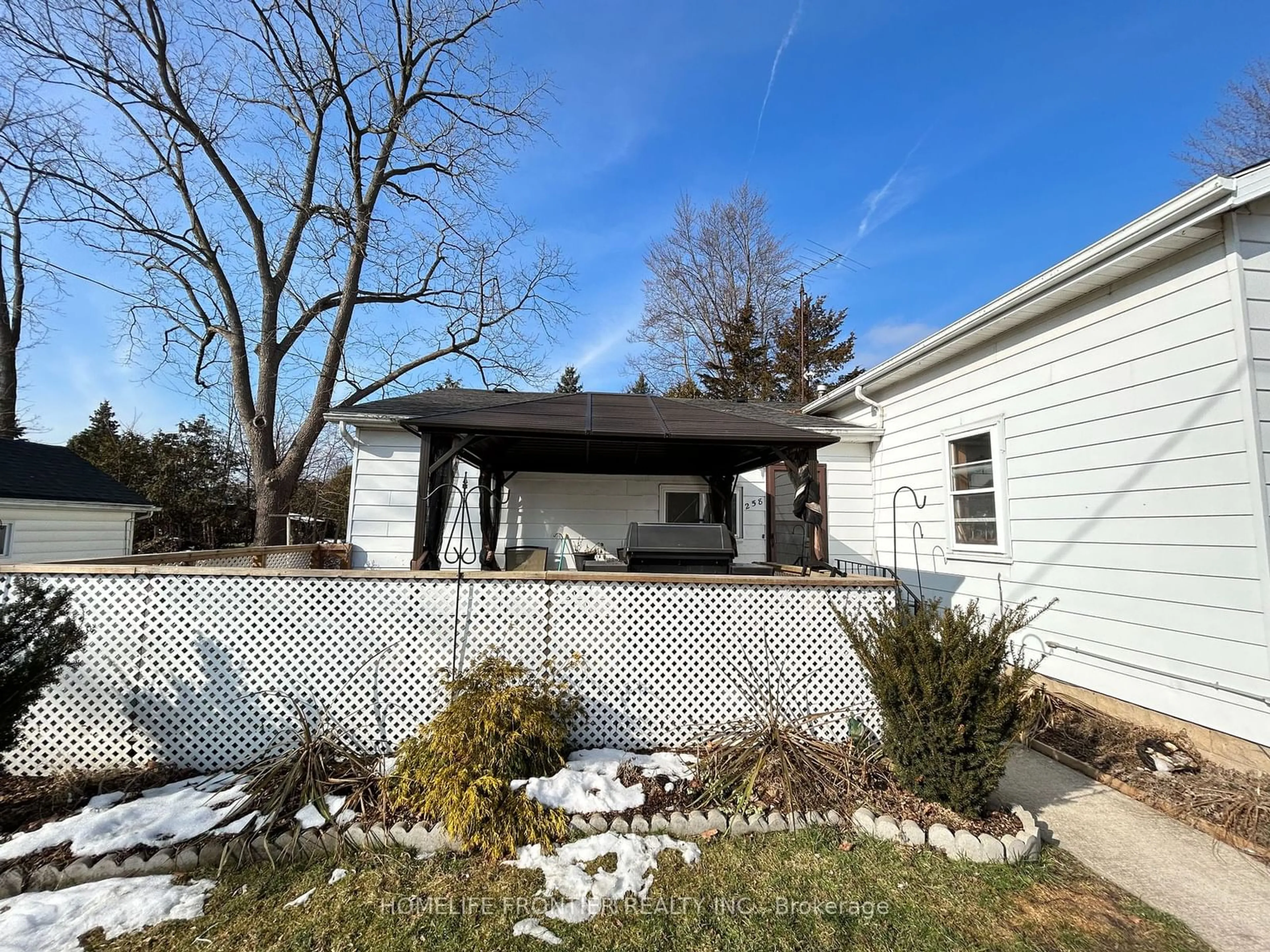 Frontside or backside of a home, the fenced backyard for 258 William St, Chatham-Kent Ontario N0P 1M0