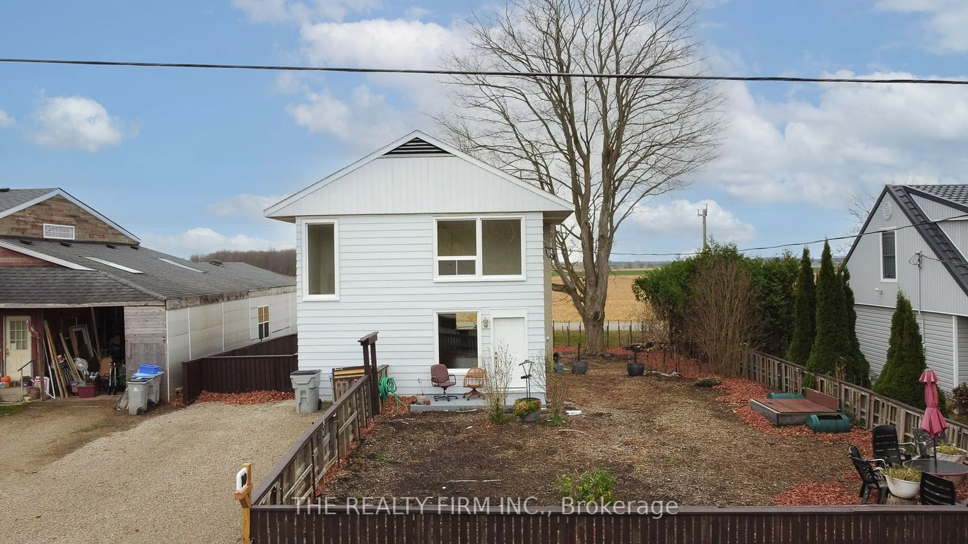 Frontside or backside of a home, the fenced backyard for 10 Quebec Rd, Huron East Ontario N0M 1L0