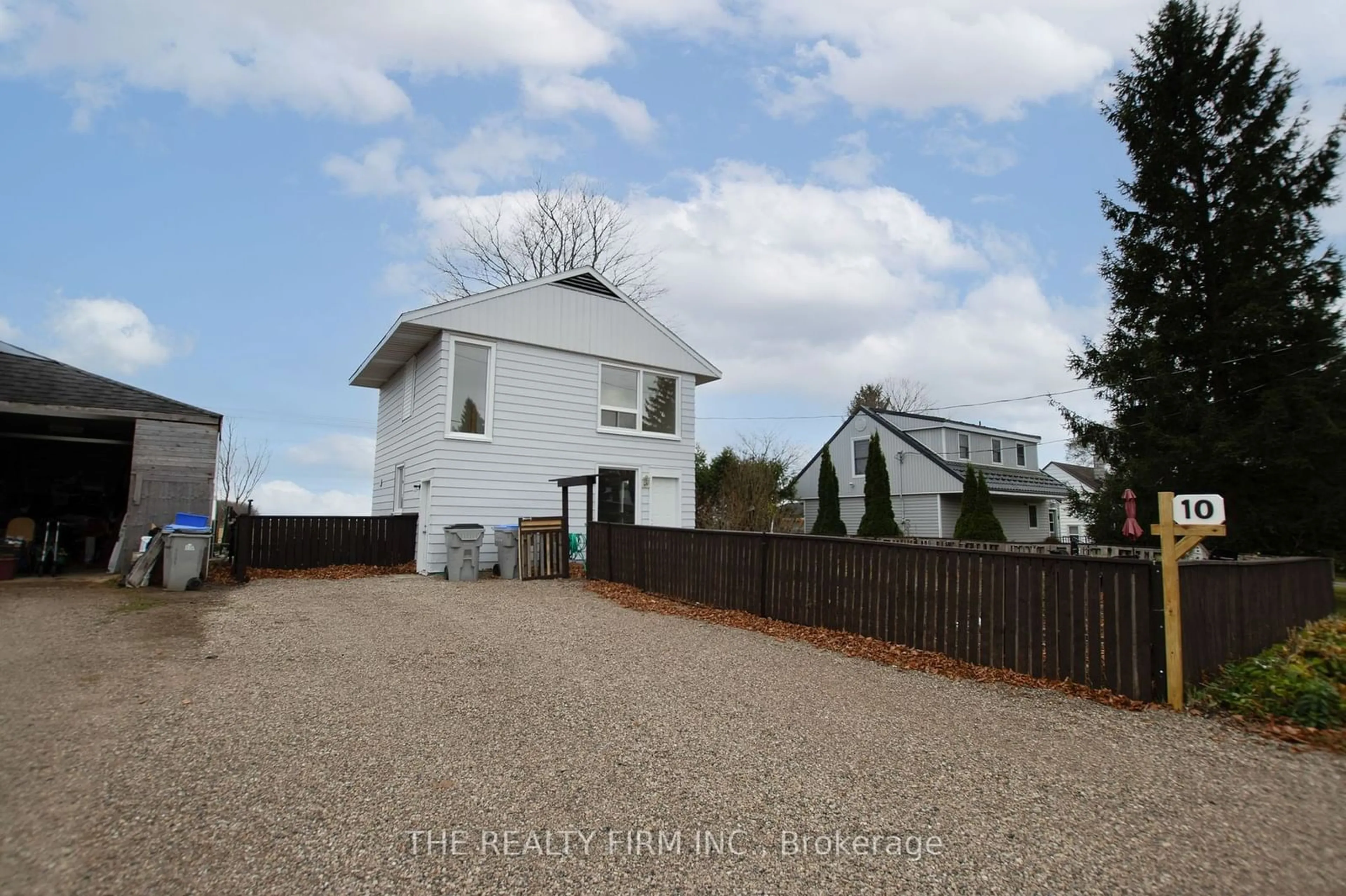 Frontside or backside of a home, the fenced backyard for 10 Quebec Rd, Huron East Ontario N0M 1L0