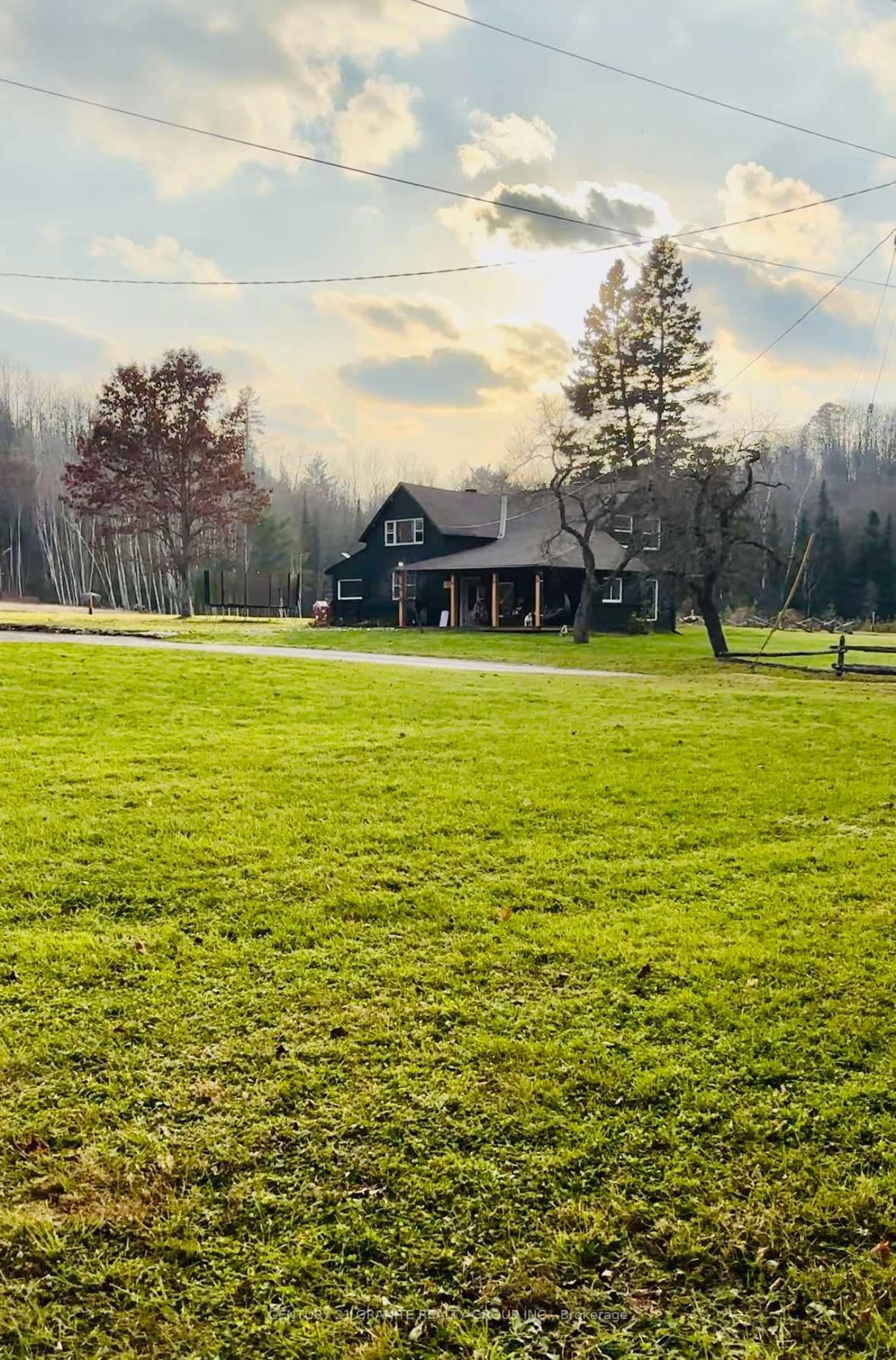 Frontside or backside of a home, the fenced backyard for 1207 Bay Lake Rd, Faraday Ontario K0L 1C0