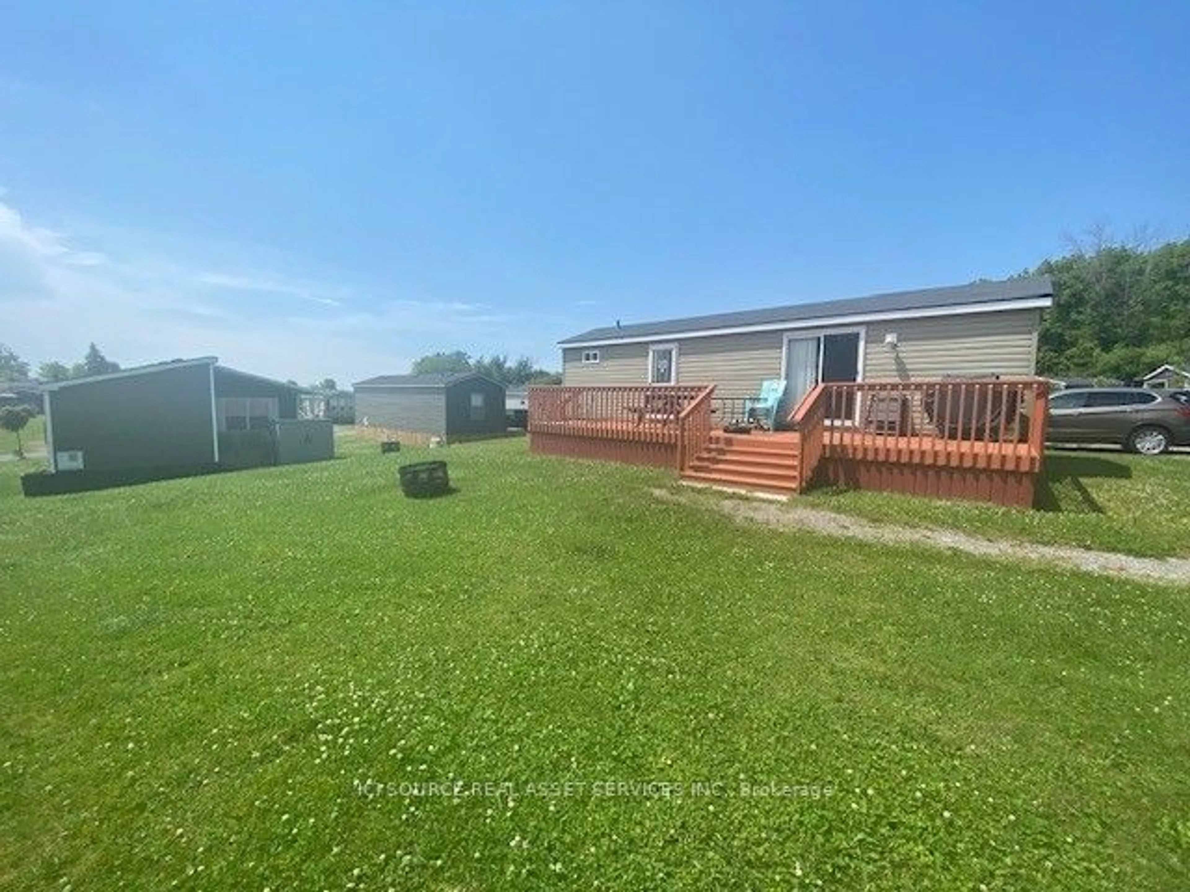 Frontside or backside of a home, the fenced backyard for 1235 Villiers Line #LWSC029, Otonabee-South Monaghan Ontario K0L 2G0