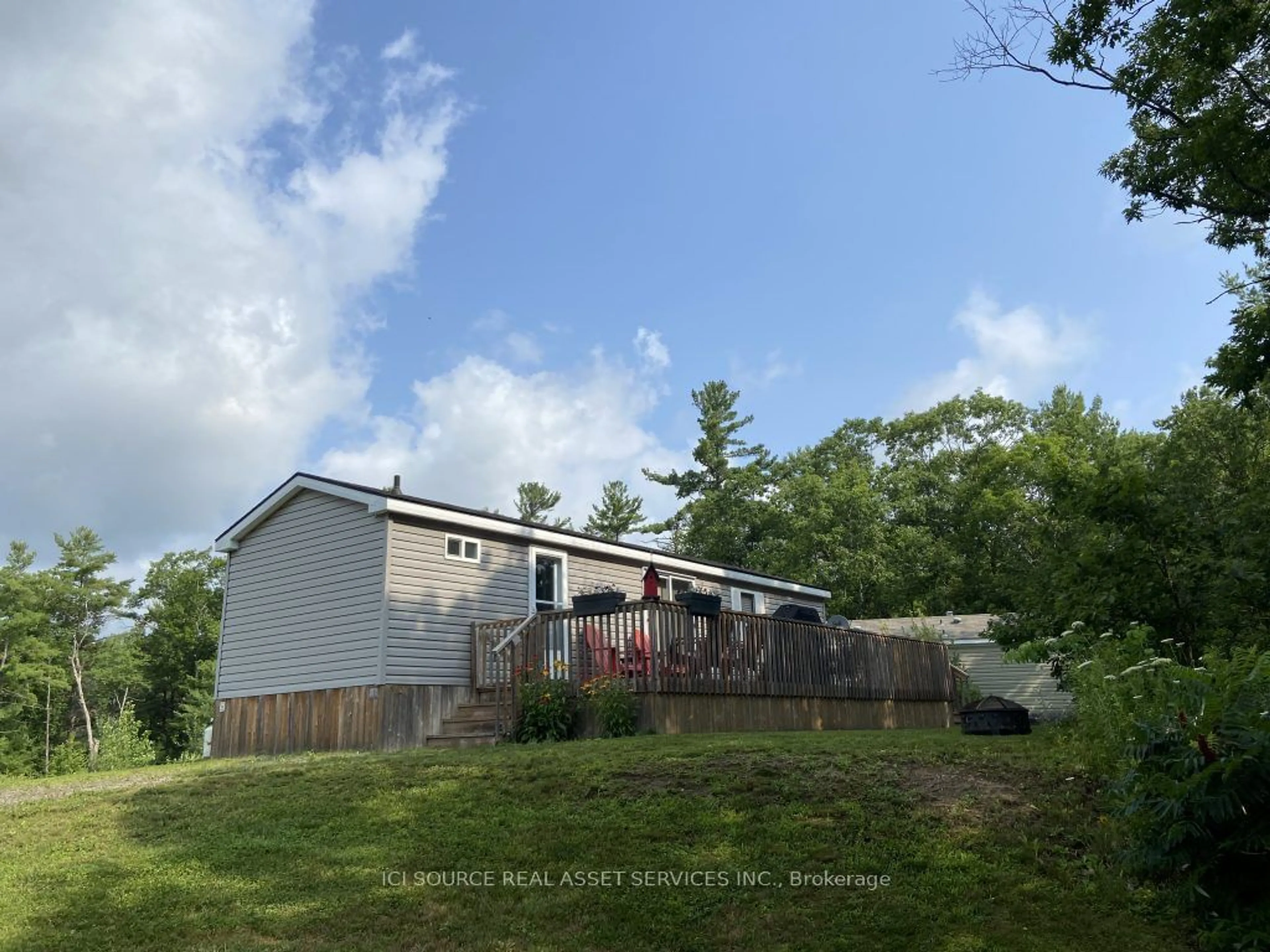 Frontside or backside of a home, the fenced backyard for 1336 S Morrison Lake Rd #MOR026, Muskoka Lakes Ontario P0E 1G0