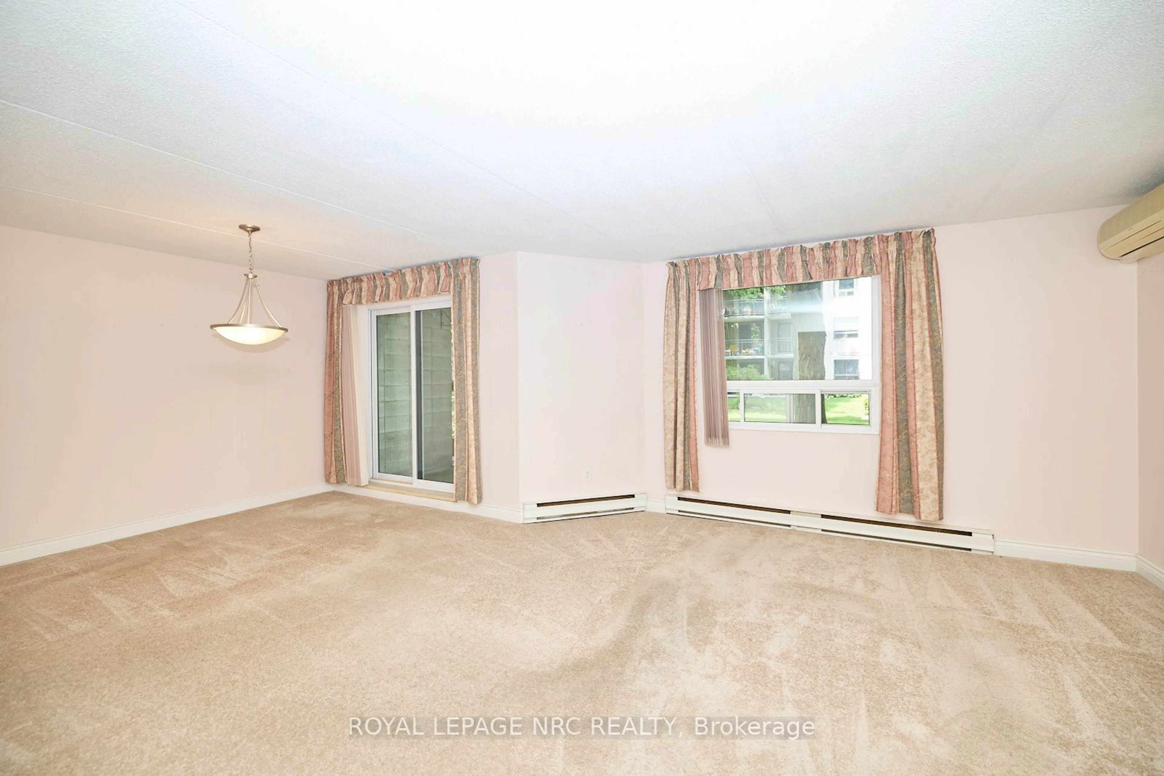 A pic of a room, carpet floors for 4658 Drummond Rd #113, Niagara Falls Ontario L2E 7E1