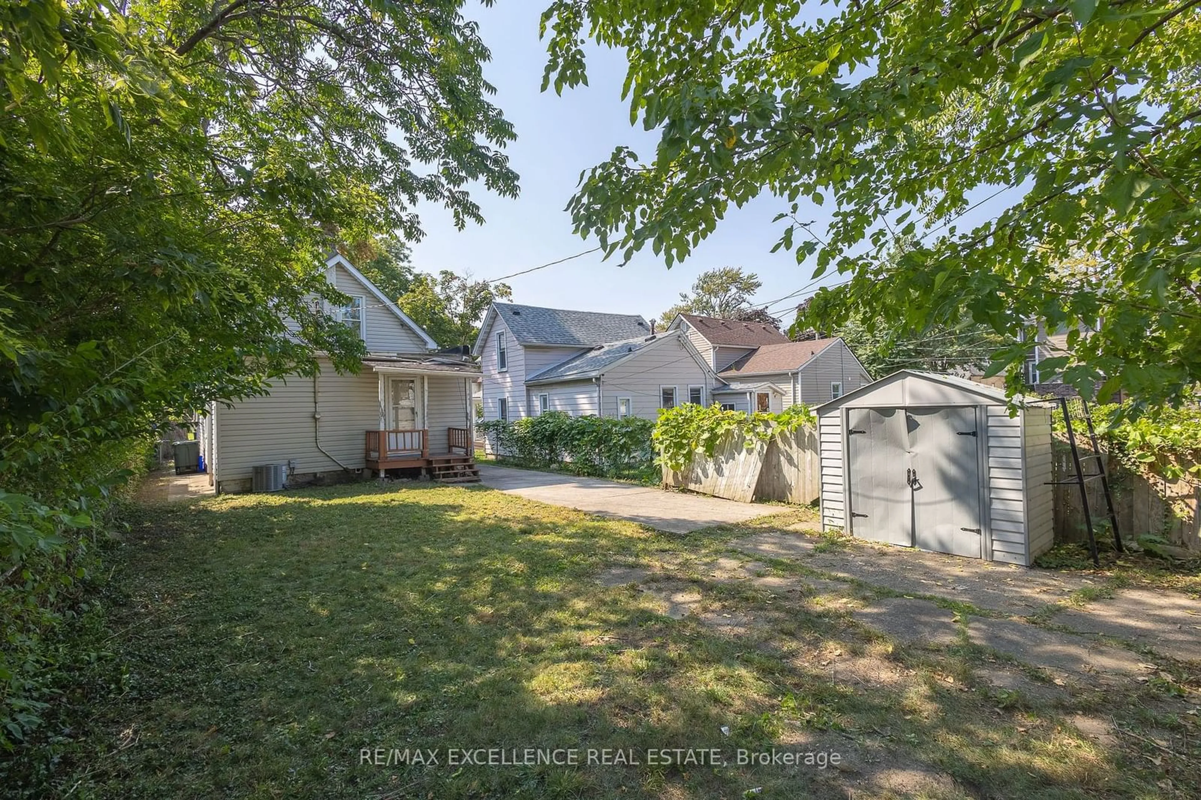 Frontside or backside of a home, the fenced backyard for 328 Bridge Ave, Windsor Ontario N9B 2M4