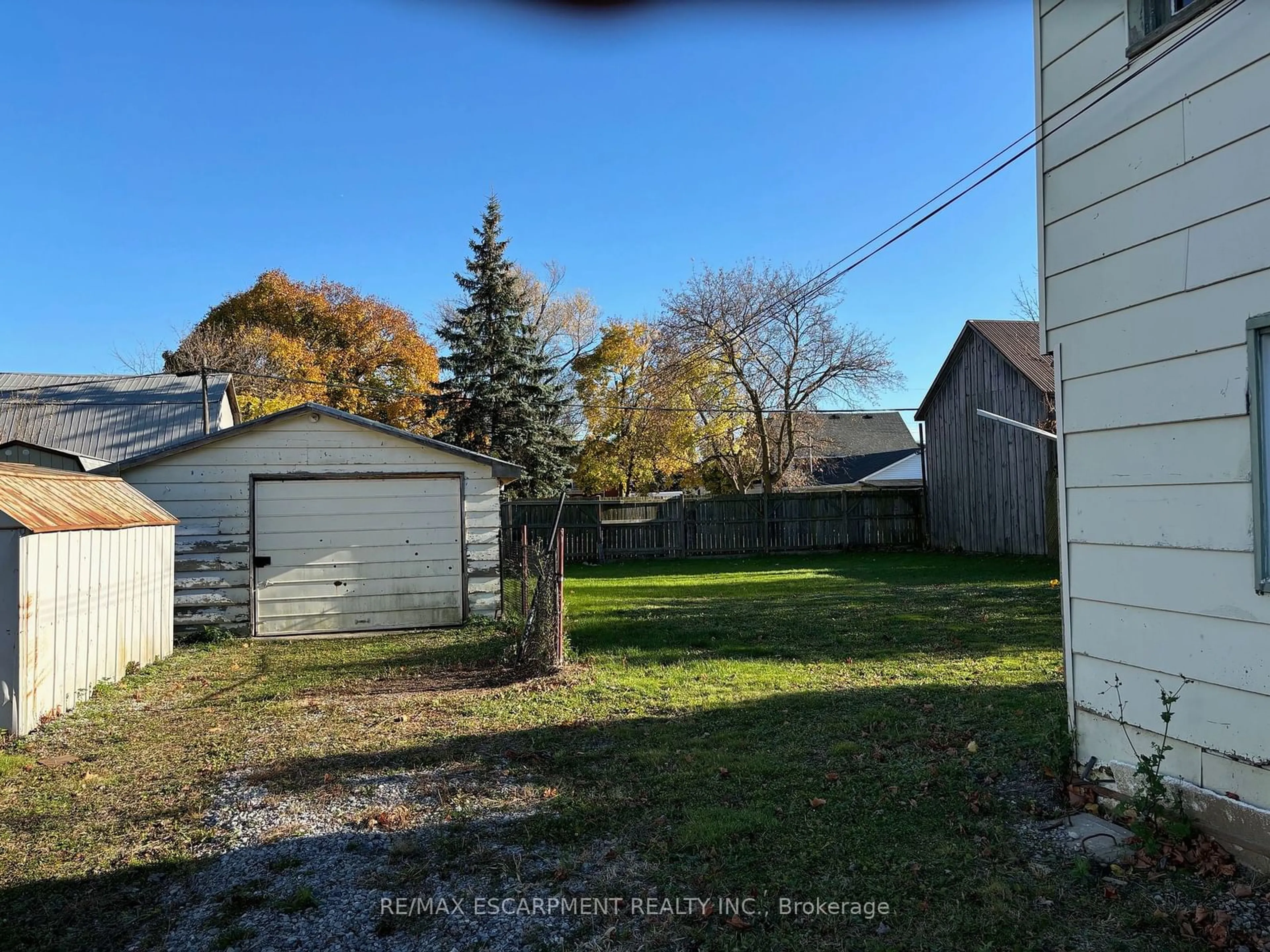 Frontside or backside of a home, the fenced backyard for 45 Howard St, Haldimand Ontario N0A 1H0