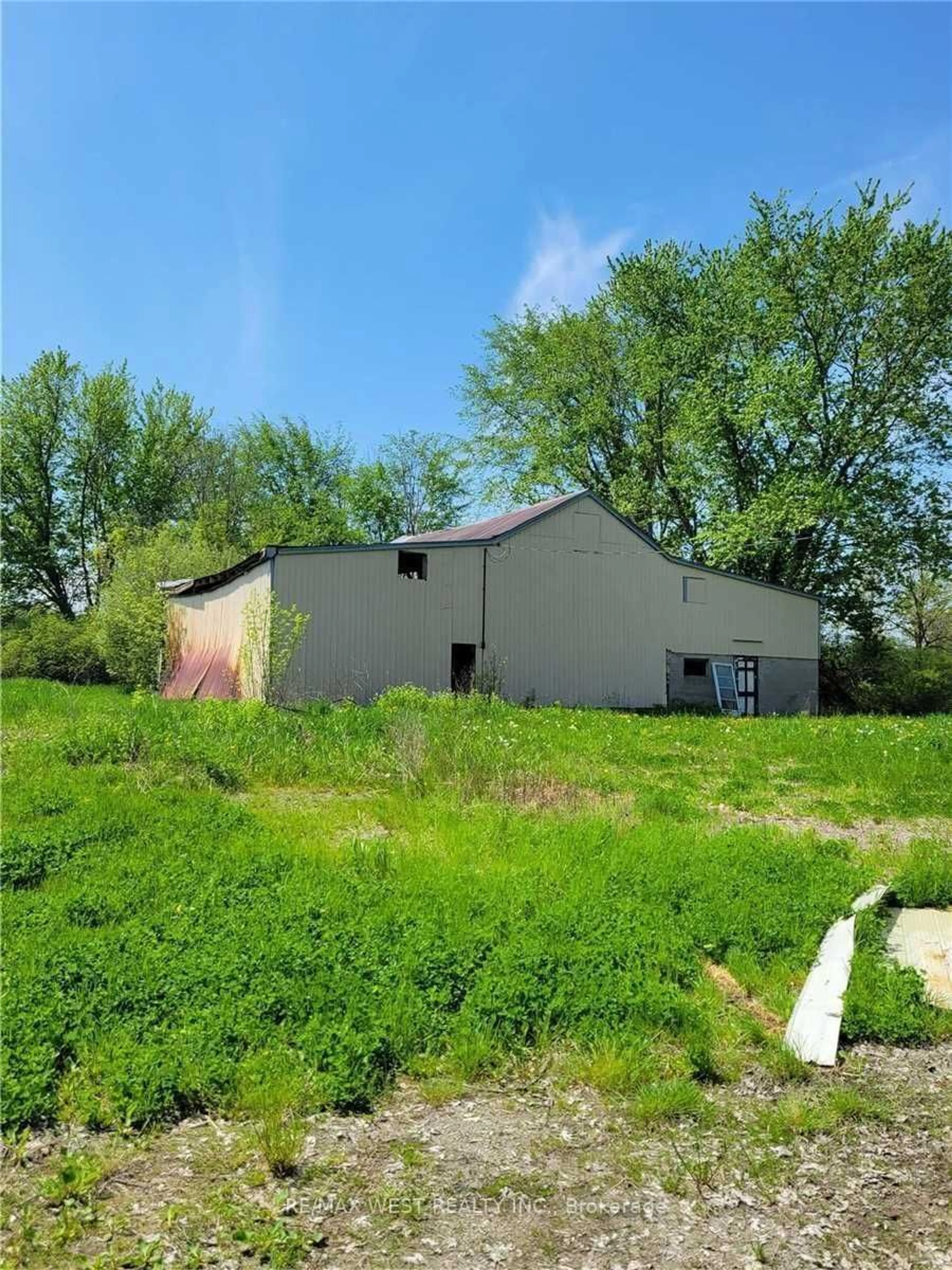 Frontside or backside of a home, the fenced backyard for 52149 Wilford Rd, Wainfleet Ontario L0S 1V0