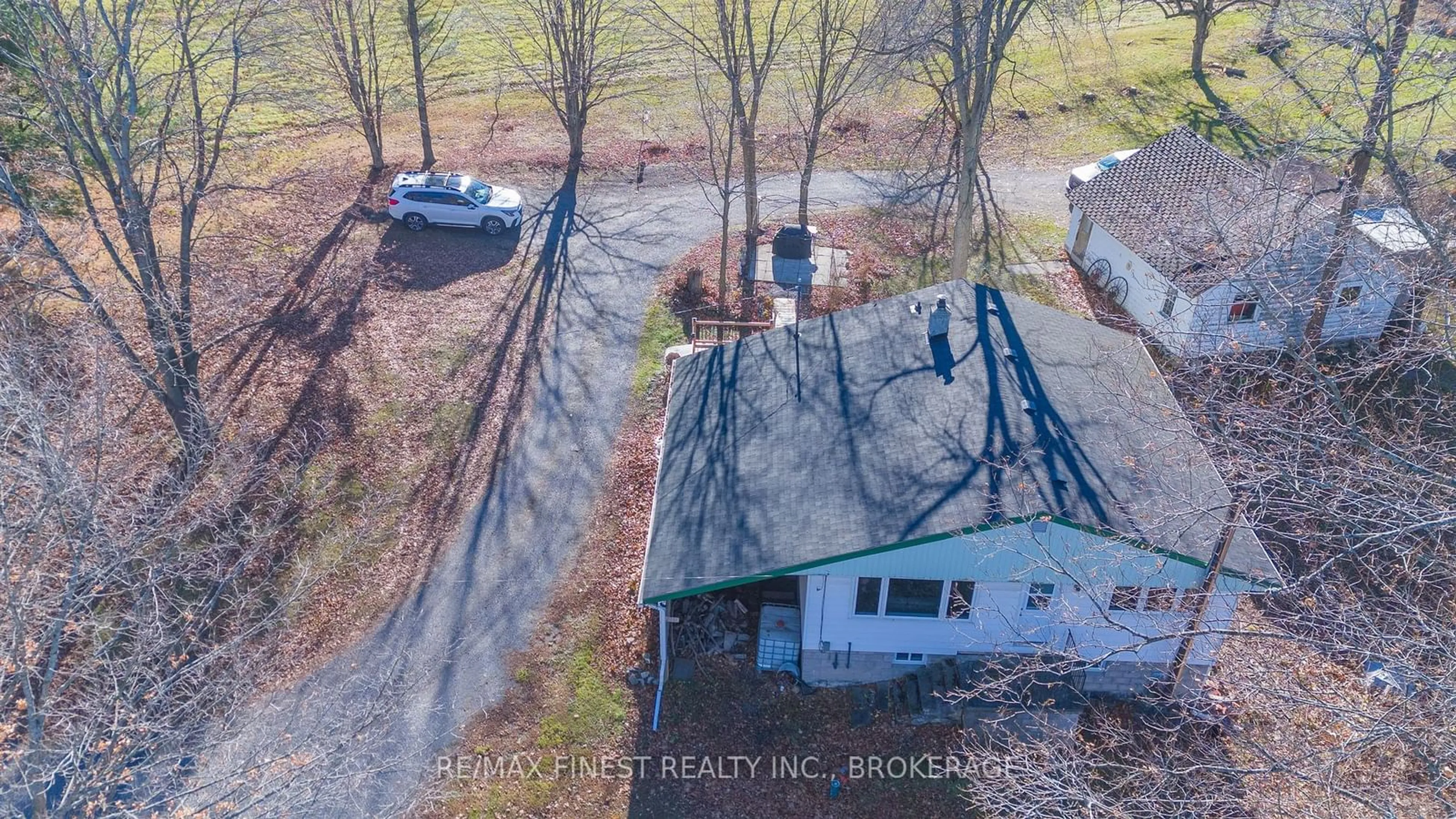 Frontside or backside of a home, the fenced backyard for 2221 Burbrook Rd, Kingston Ontario K7L 4V4