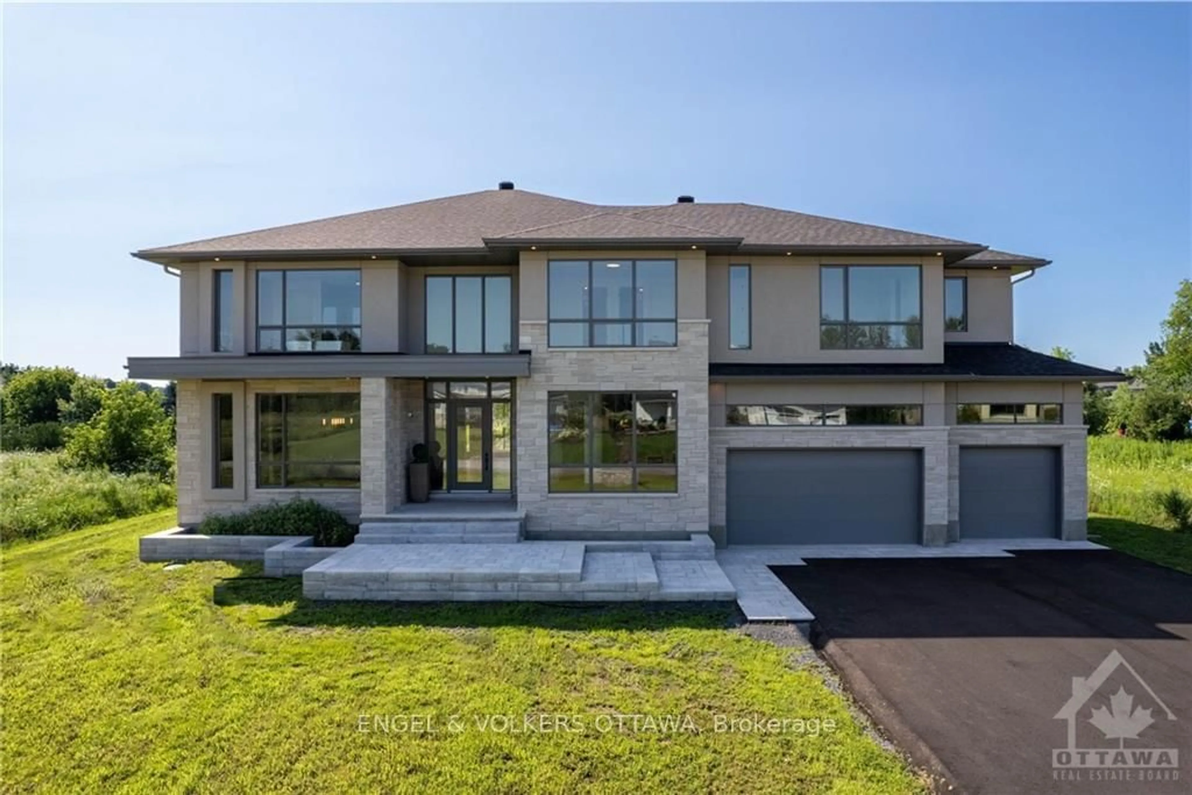 Frontside or backside of a home, the street view for 705 MCMANUS Ave, Manotick - Kars - Rideau Twp and Area Ontario K4M 0B2