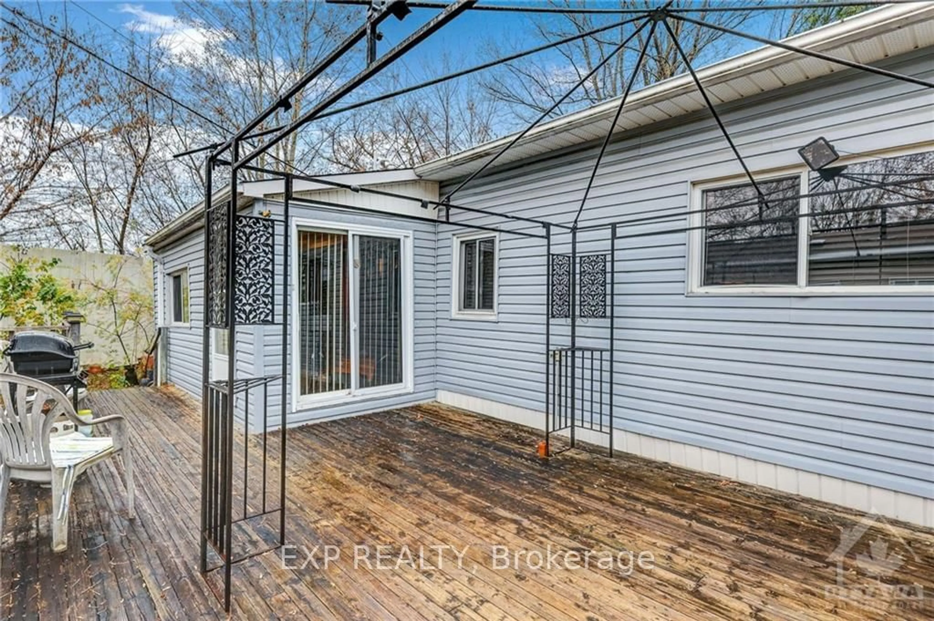 A pic from exterior of the house or condo, the fenced backyard for 6 ASH St, Bells Corners and South to Fallowfield Ontario K2H 7S3