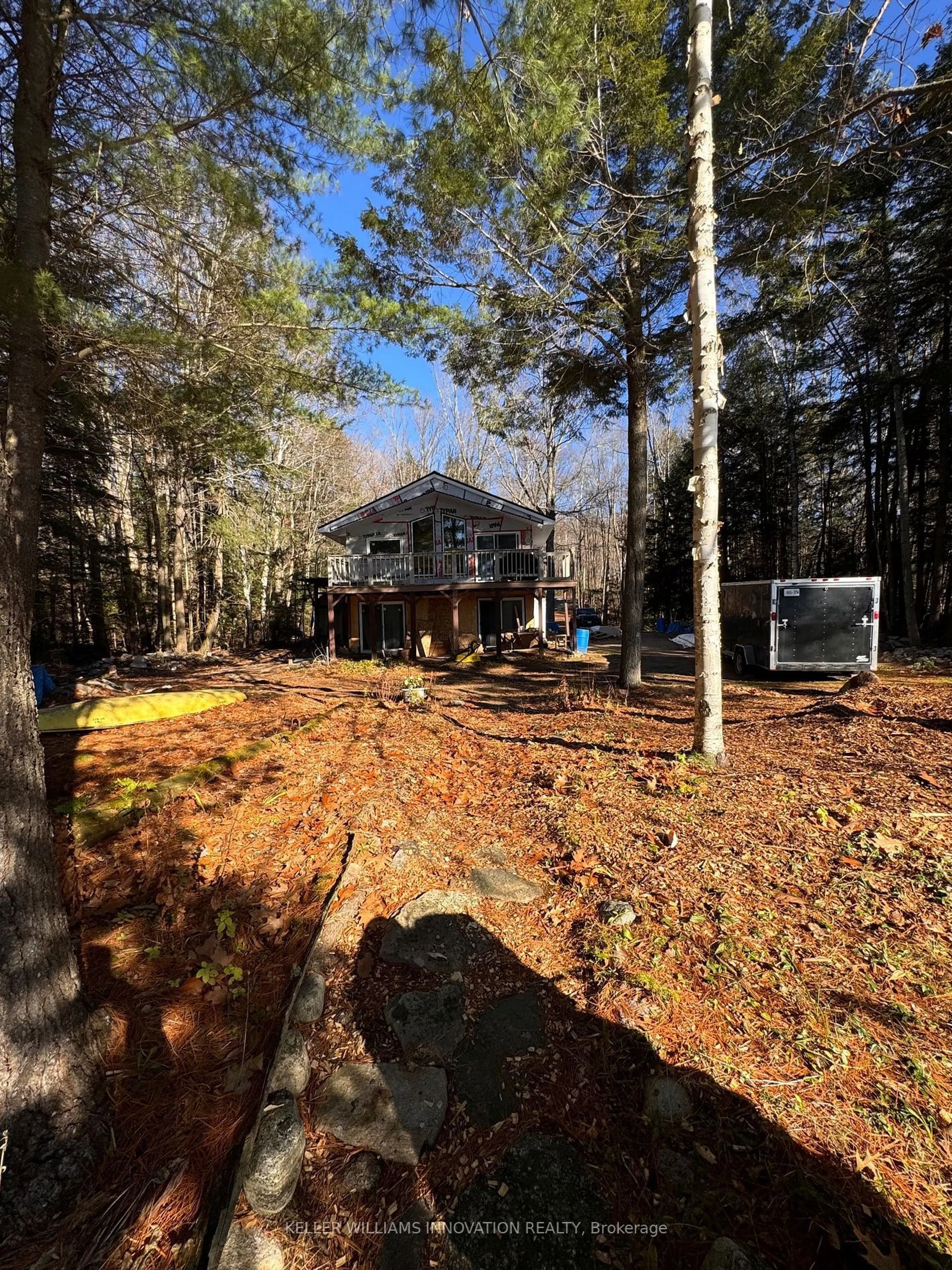 Frontside or backside of a home, the fenced backyard for 1349 Ross Lake Rd, Dysart et al Ontario K0M 1S0