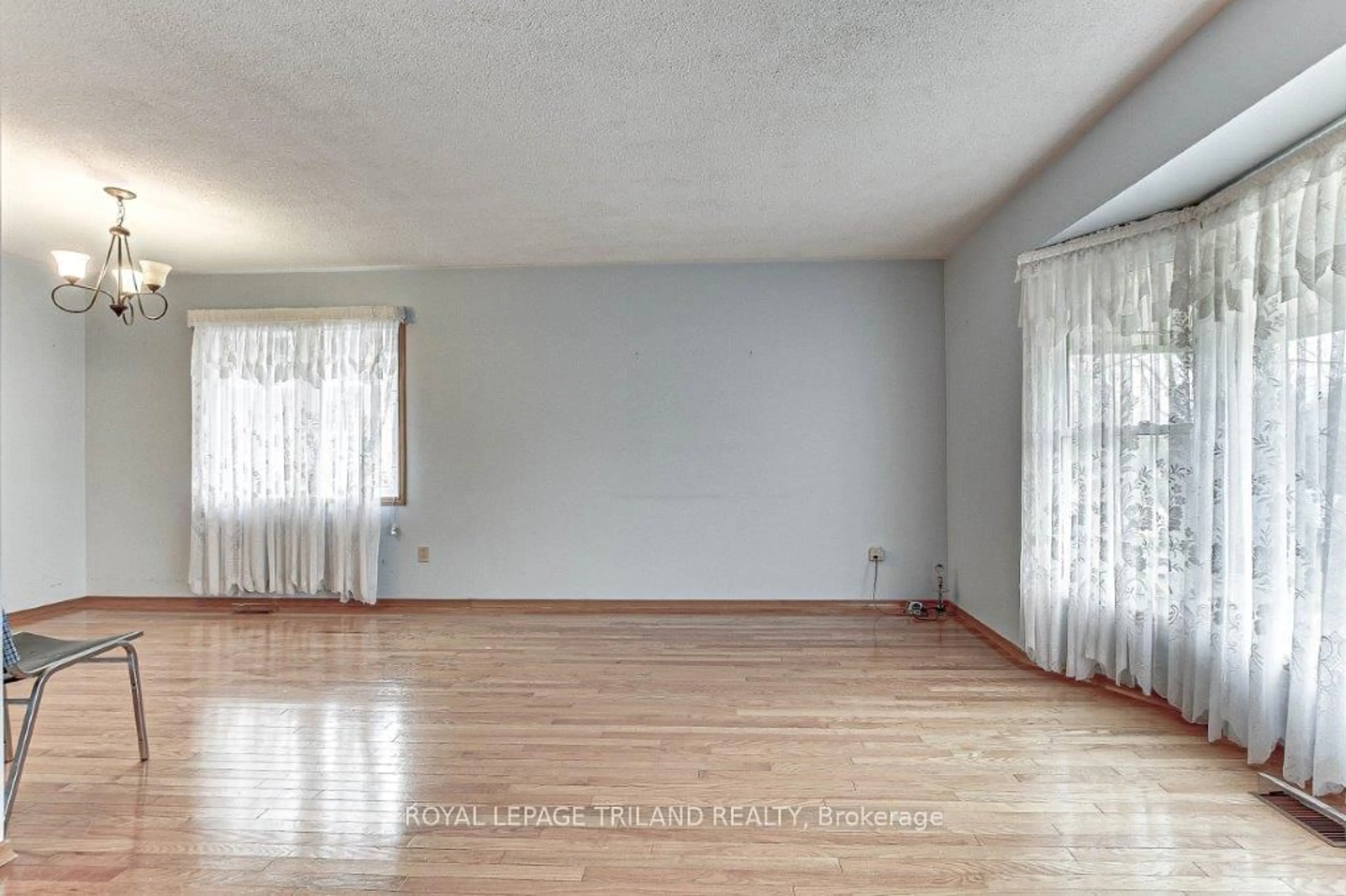 A pic of a room, wood floors for 7 Ripley Lane, St. Thomas Ontario N5R 5X1