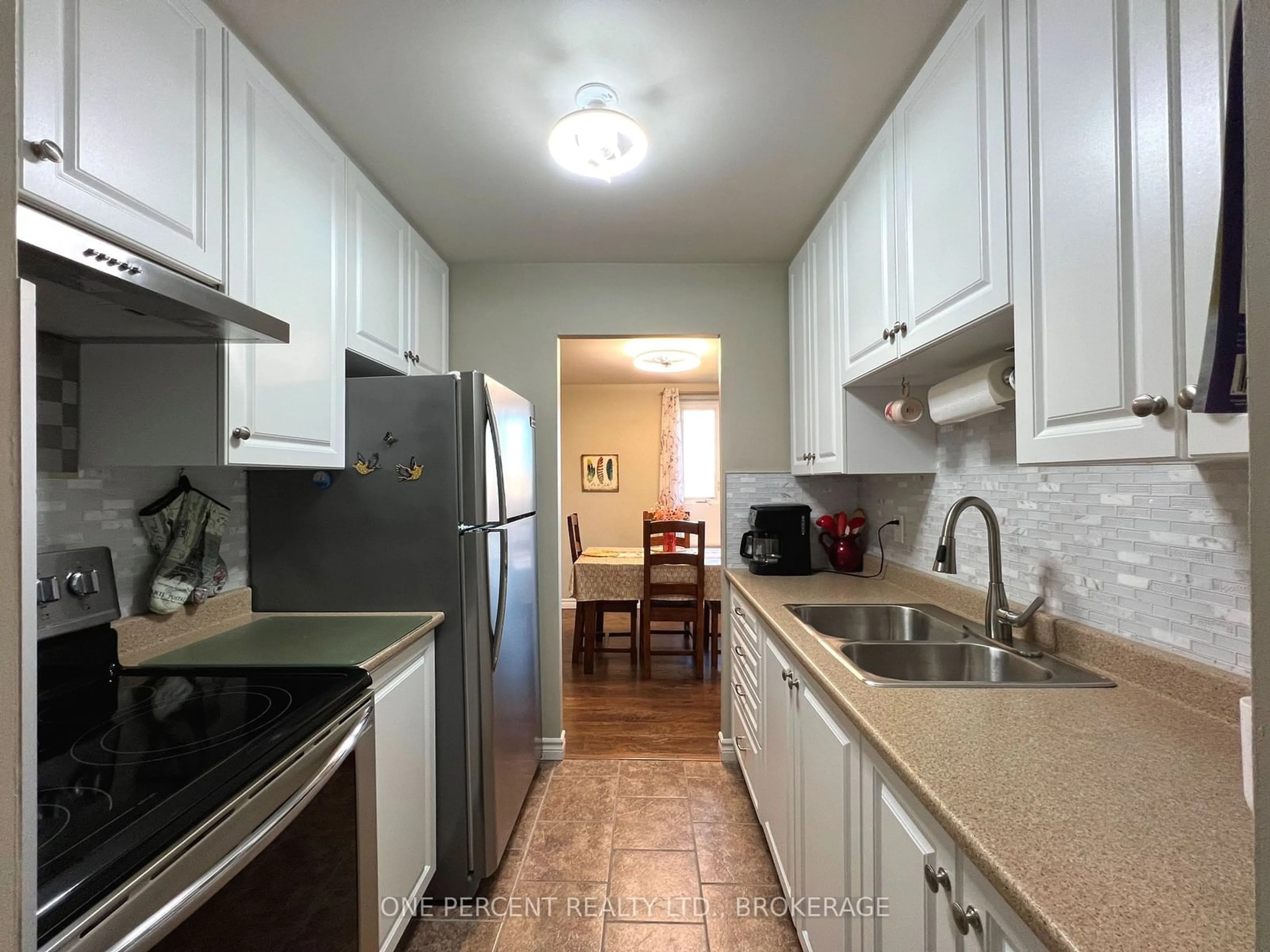 Standard kitchen, wood floors for 358 Queen Mary Rd #515, Kingston Ontario K7M 7E8