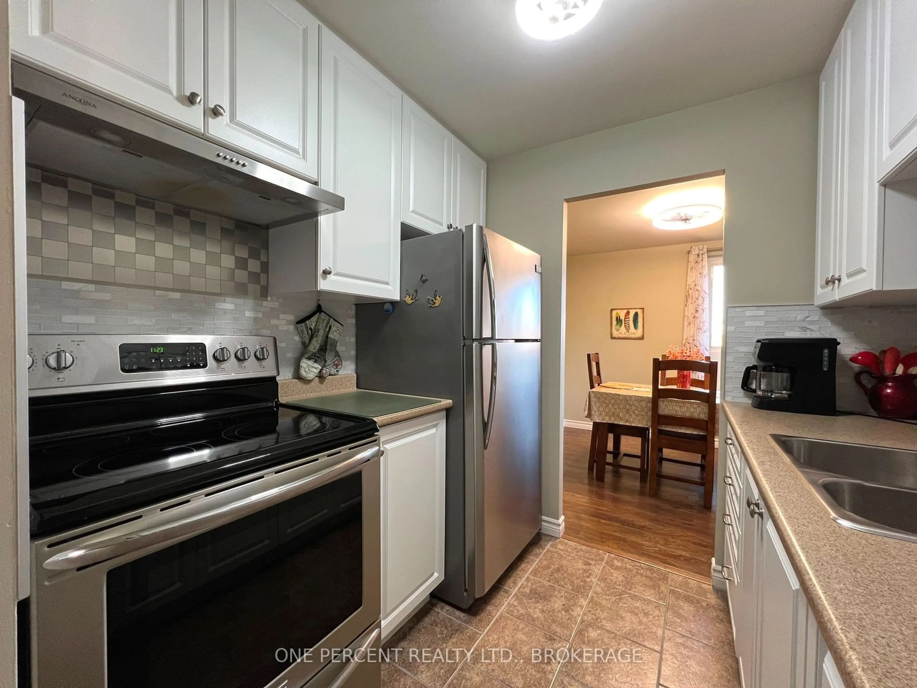 Standard kitchen, wood floors for 358 Queen Mary Rd #515, Kingston Ontario K7M 7E8