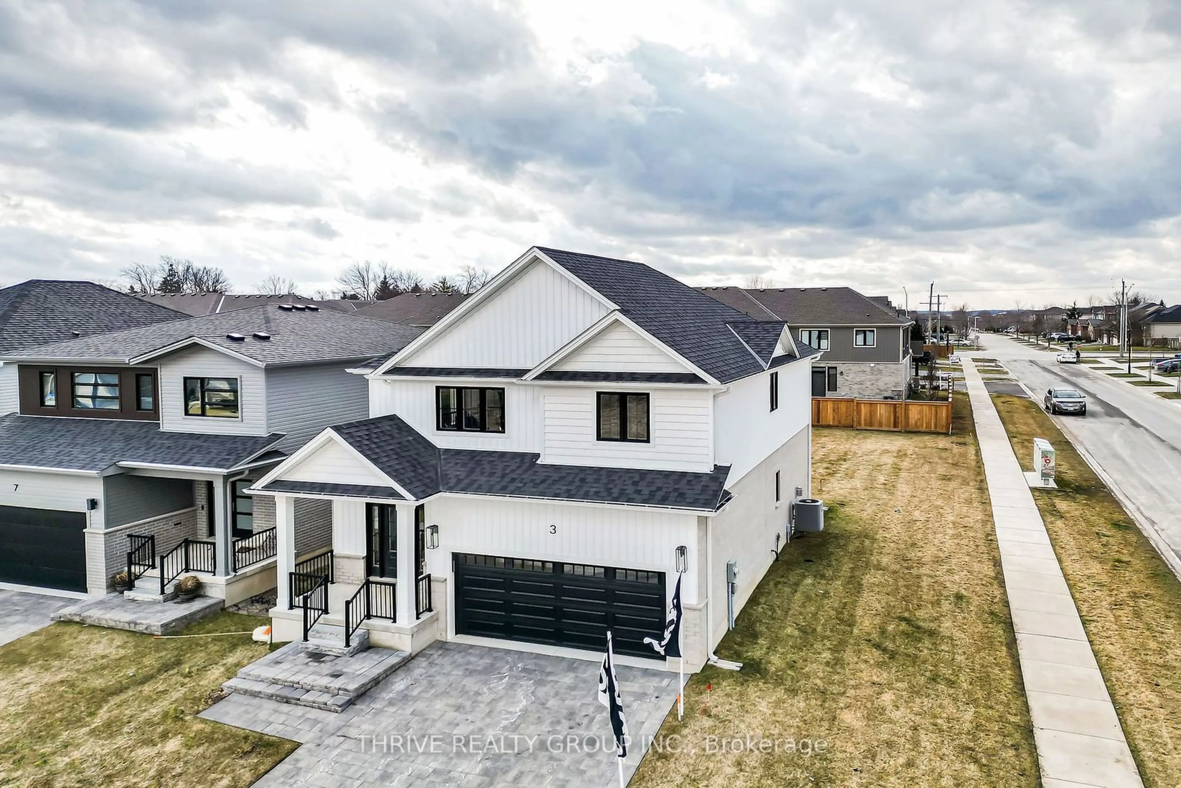 Frontside or backside of a home, the fenced backyard for 64 Basil Cres, Middlesex Centre Ontario N0M 2A0