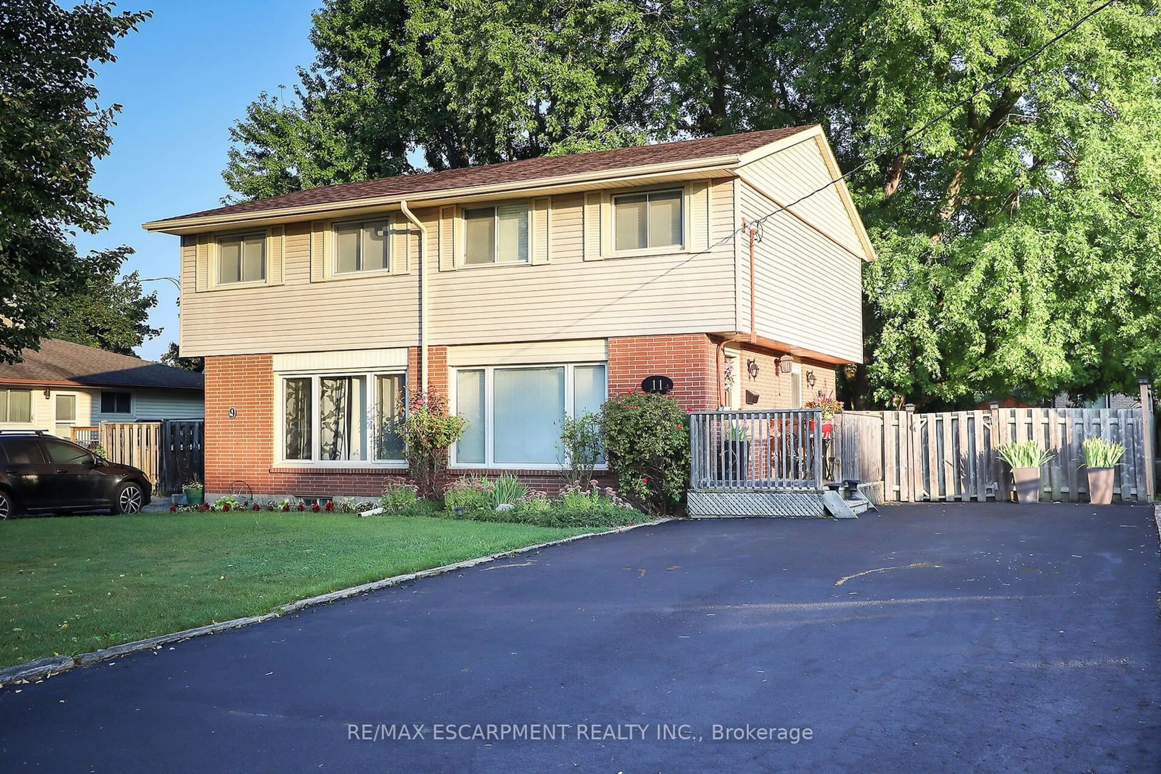 Frontside or backside of a home, the fenced backyard for 11 Westlake Lane, St. Catharines Ontario L2N 4C9