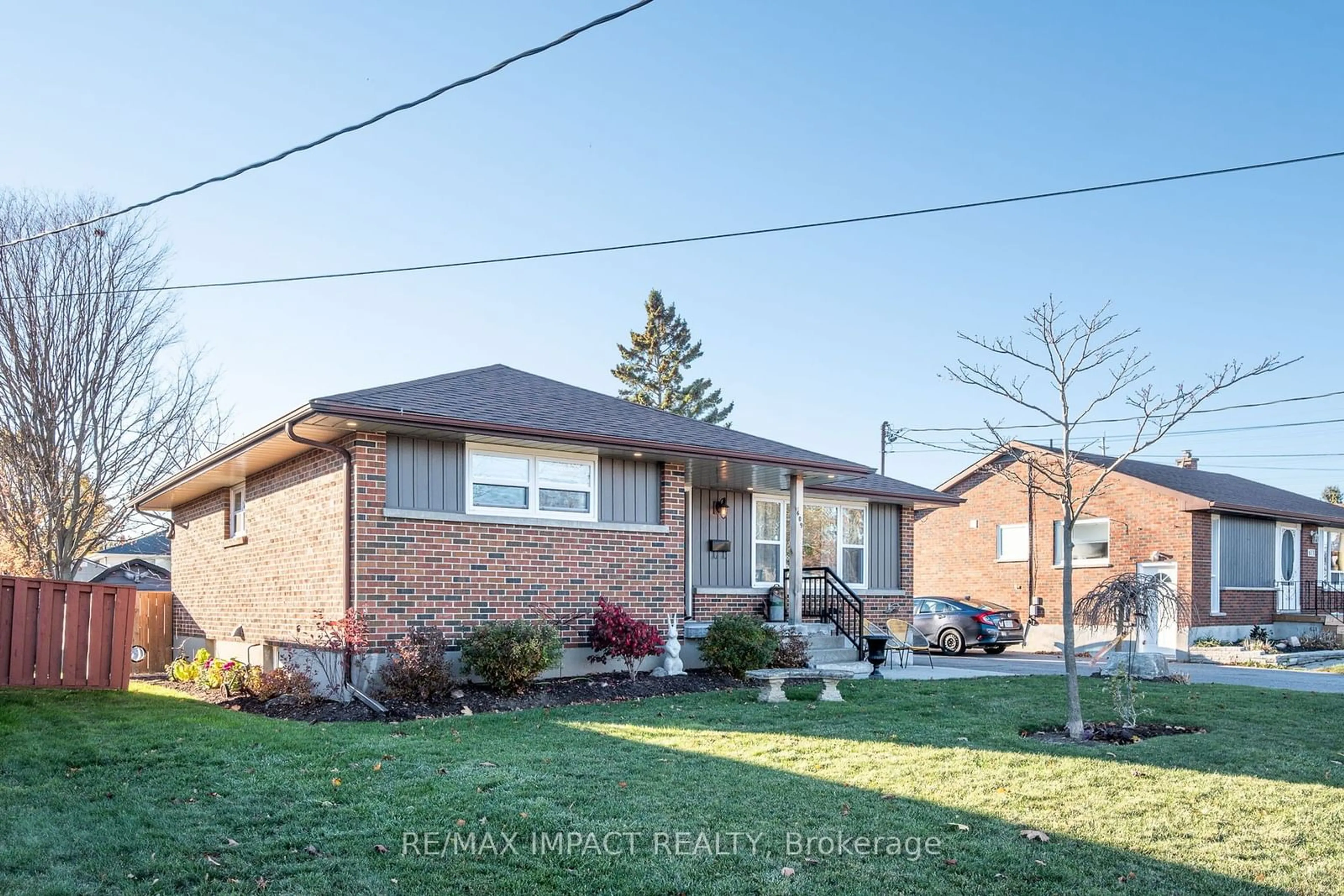 Frontside or backside of a home, the fenced backyard for 609 Norma St, Cobourg Ontario K9A 2T7