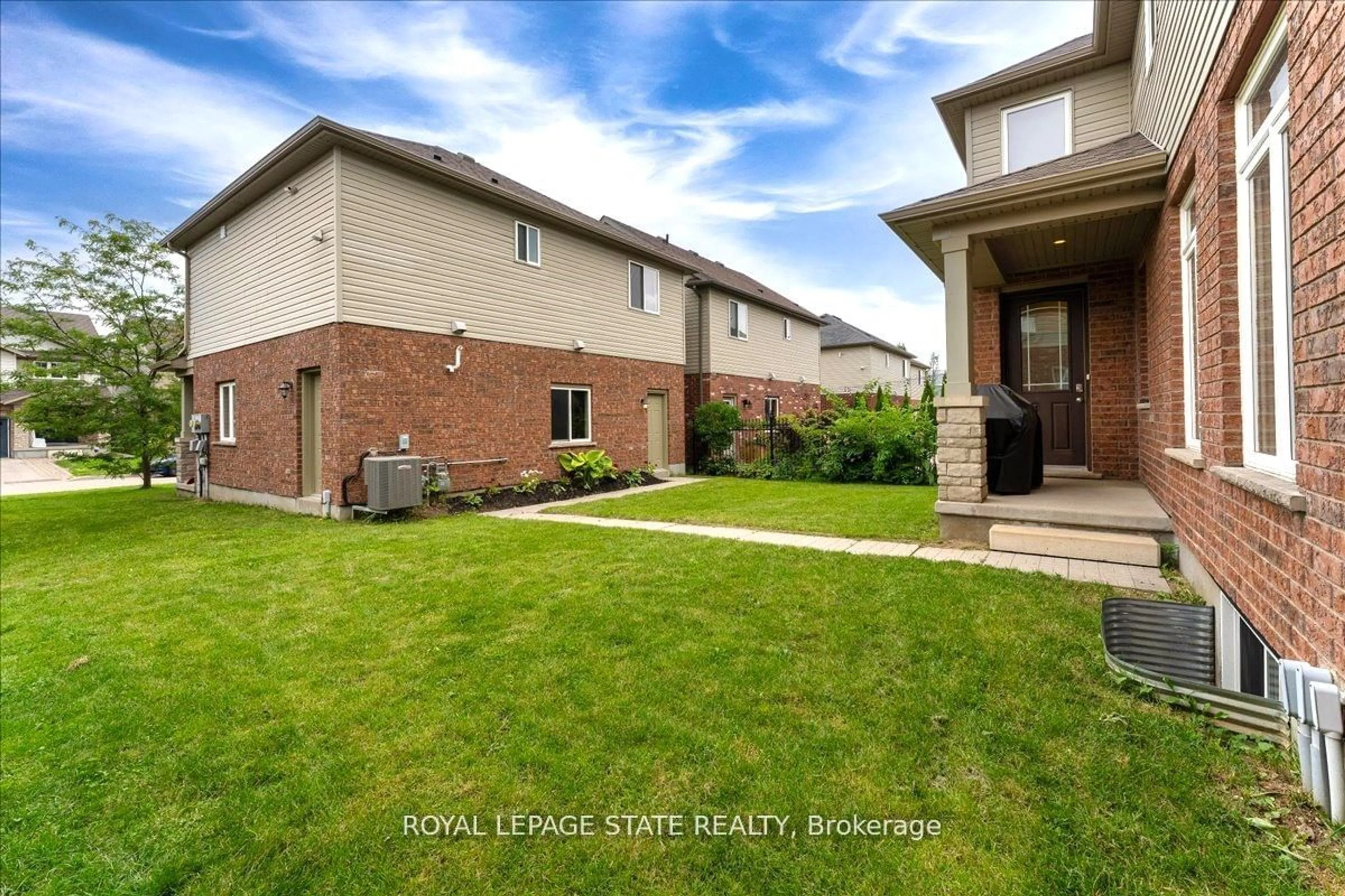 A pic from exterior of the house or condo, the fenced backyard for 9 Tolton Dr, Guelph Ontario N1L 0C4