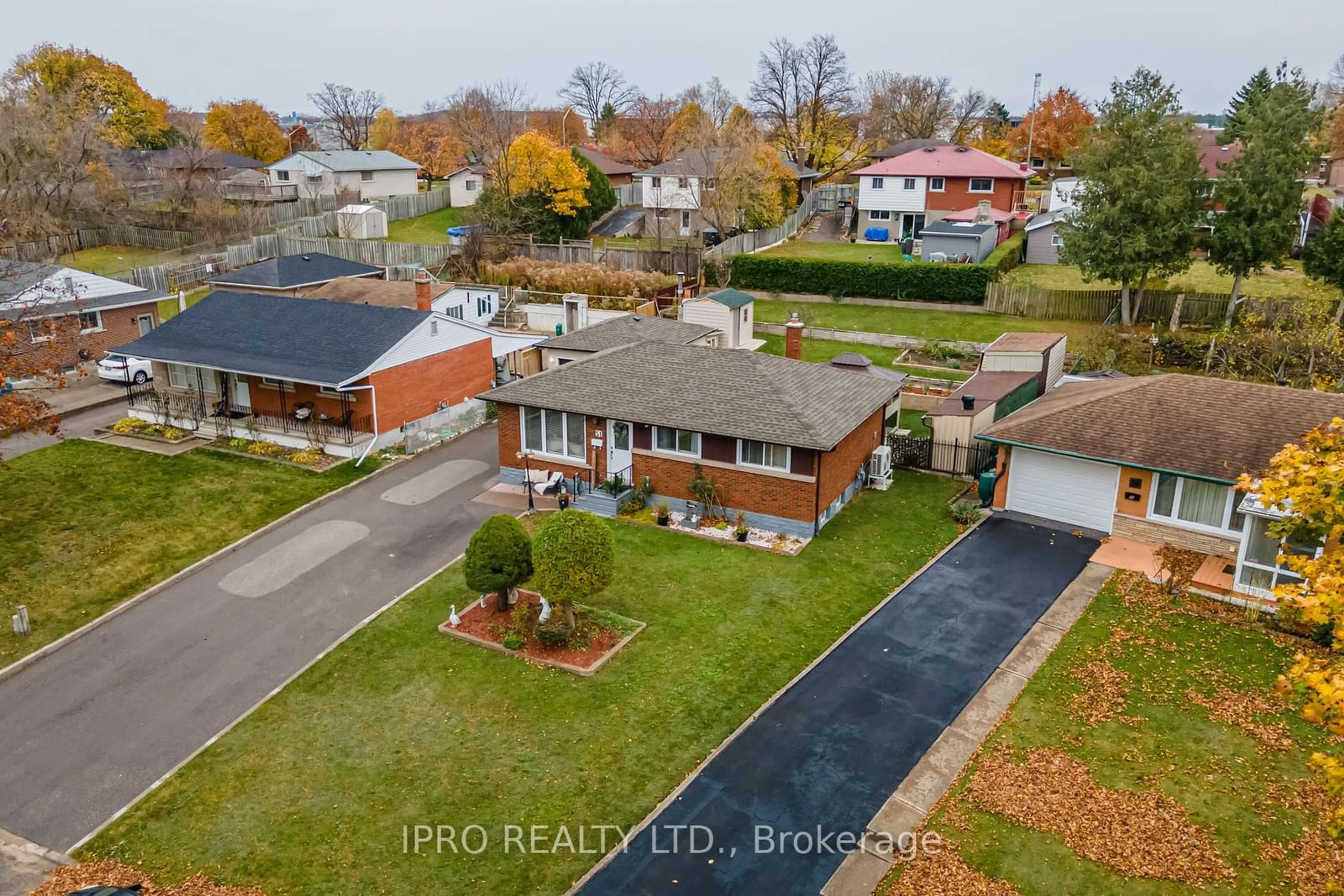 Frontside or backside of a home, the fenced backyard for 51 Radford Ave, Cambridge Ontario N1R 5L8