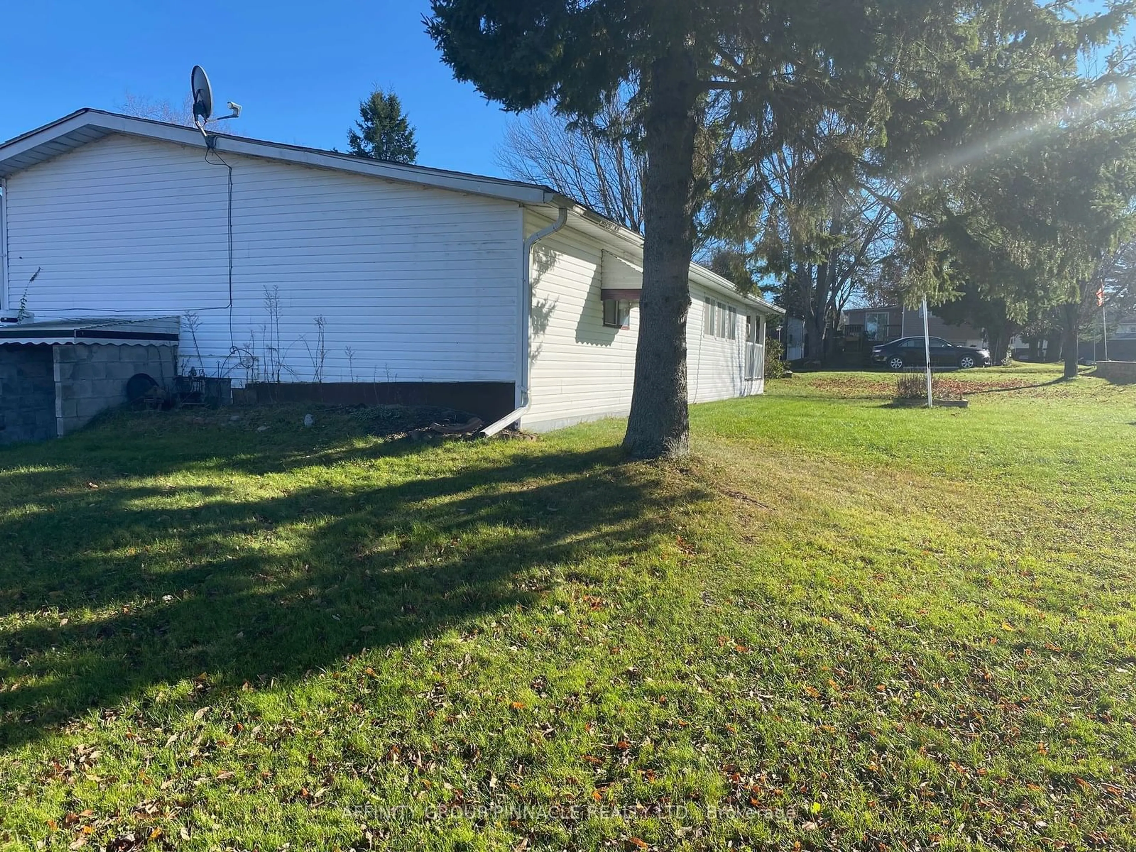 Frontside or backside of a home, the fenced backyard for 11 Fenelon Way, Kawartha Lakes Ontario K9V 1R4