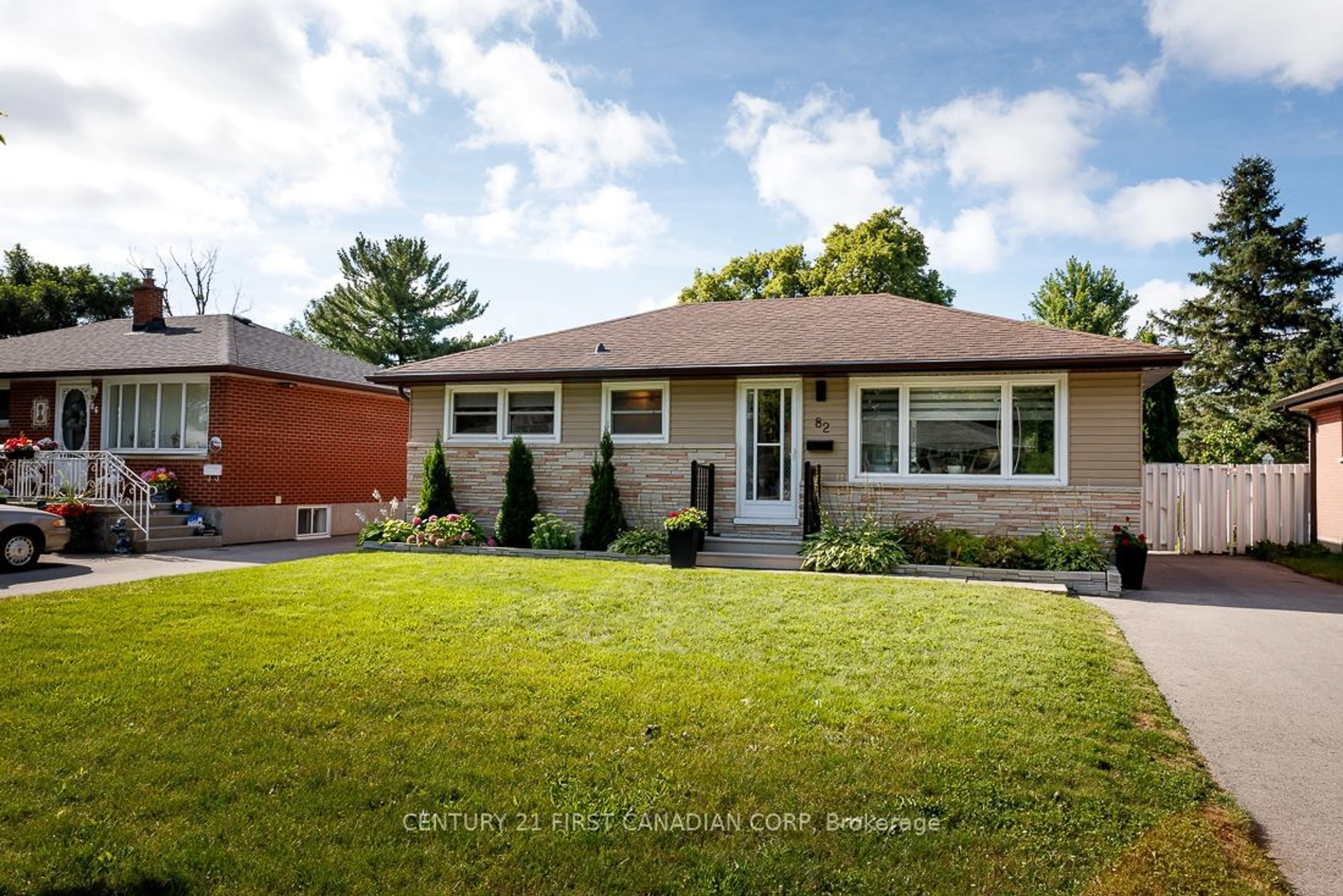 Frontside or backside of a home, the fenced backyard for 82 Queenston Cres, London Ontario N5W 1N6