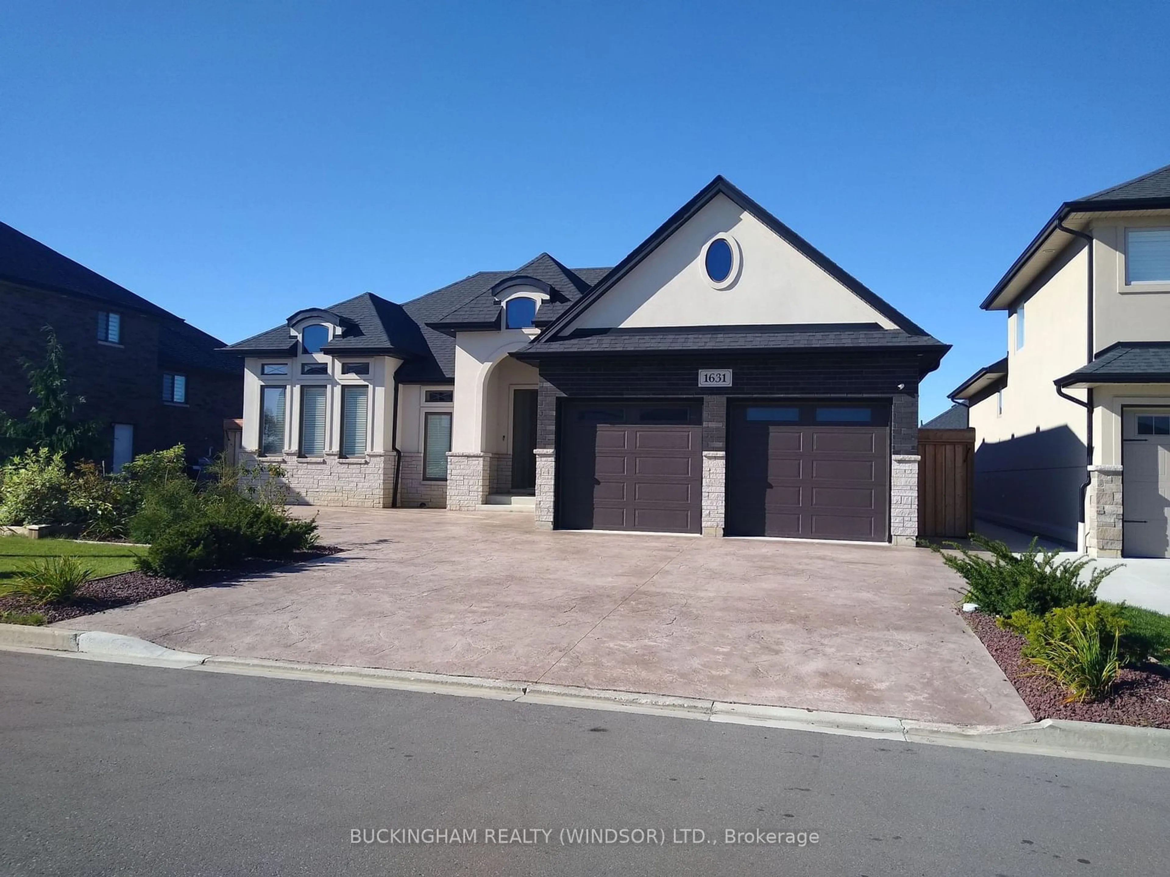 Frontside or backside of a home, the street view for 1631 Barkley Ave, Windsor Ontario N8P 0E8